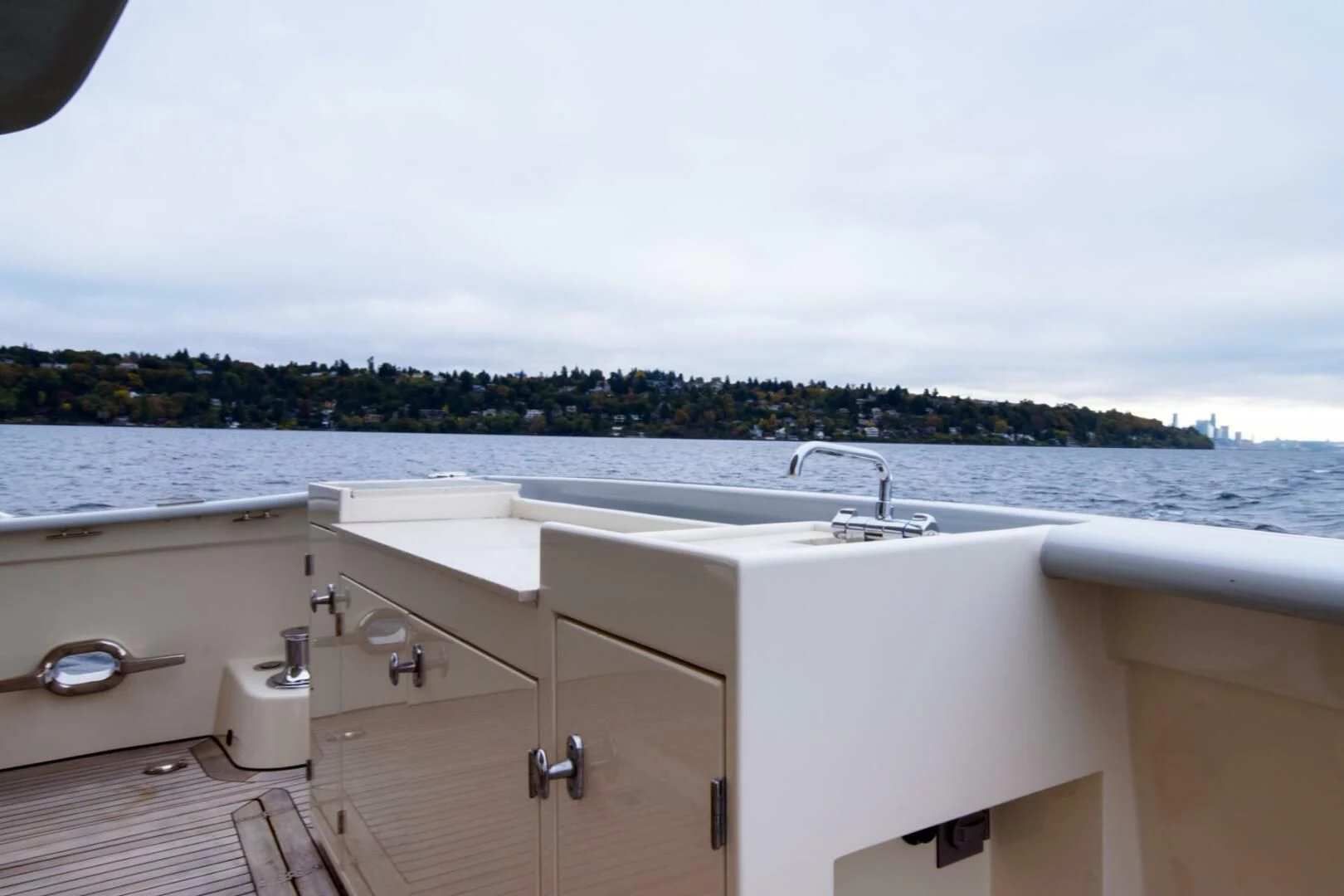 a large white bathtub with a view of a city and water aboard SEA LION Yacht for Sale