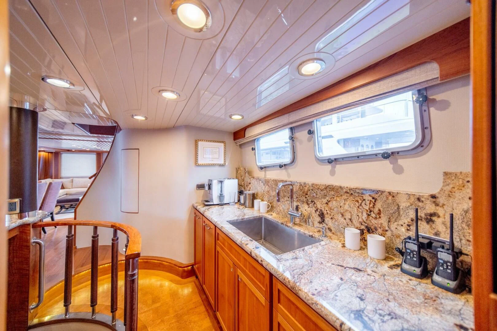 a kitchen with a countertop sink and a microwave oven aboard SEA LION Yacht for Sale