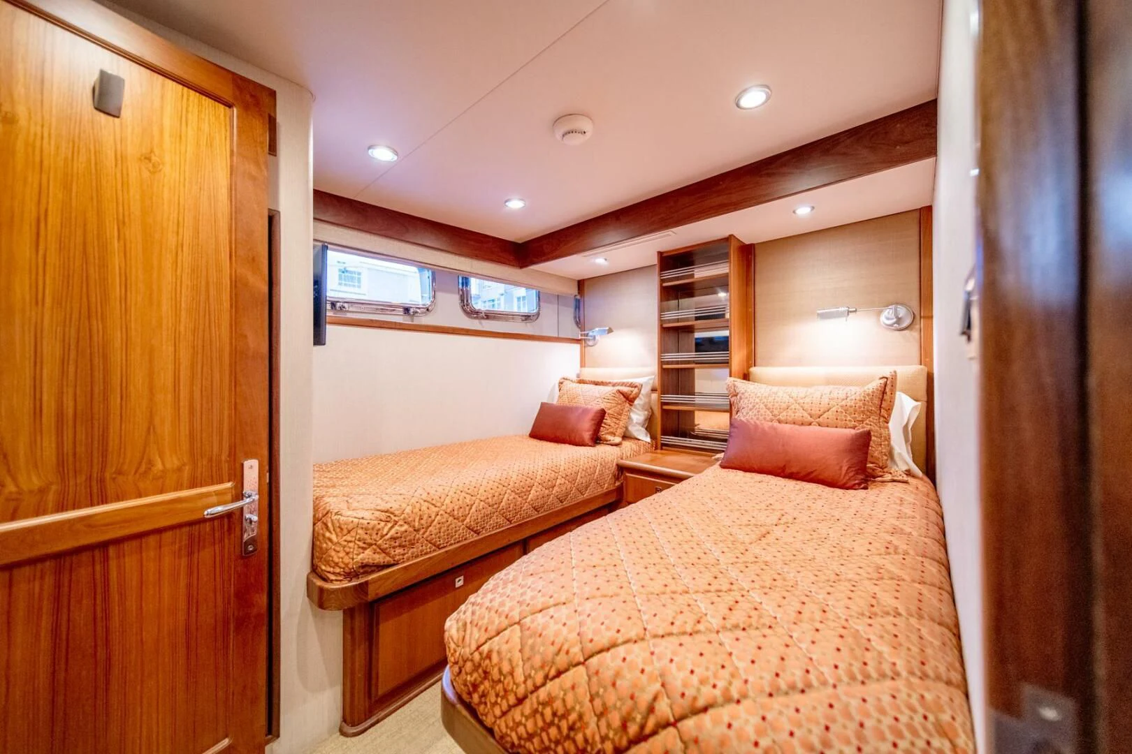 a bedroom with a bed and a closet aboard SEA LION Yacht for Sale