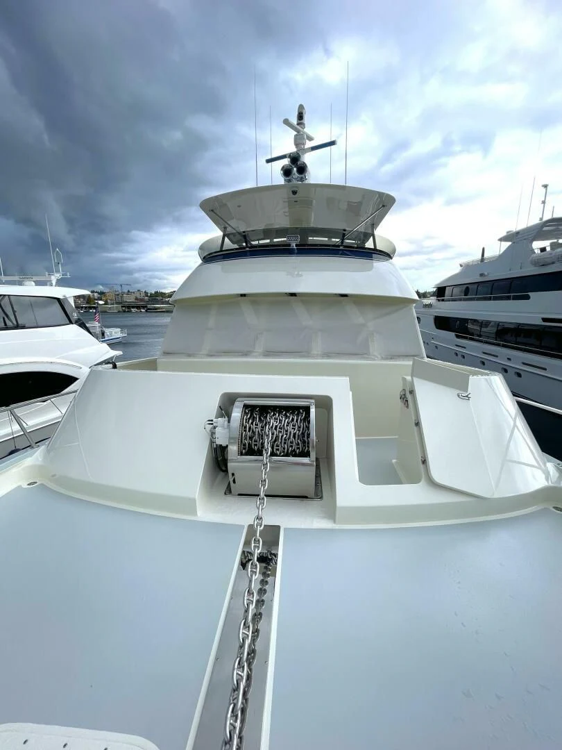a white yacht in a harbor aboard SEA LION Yacht for Sale