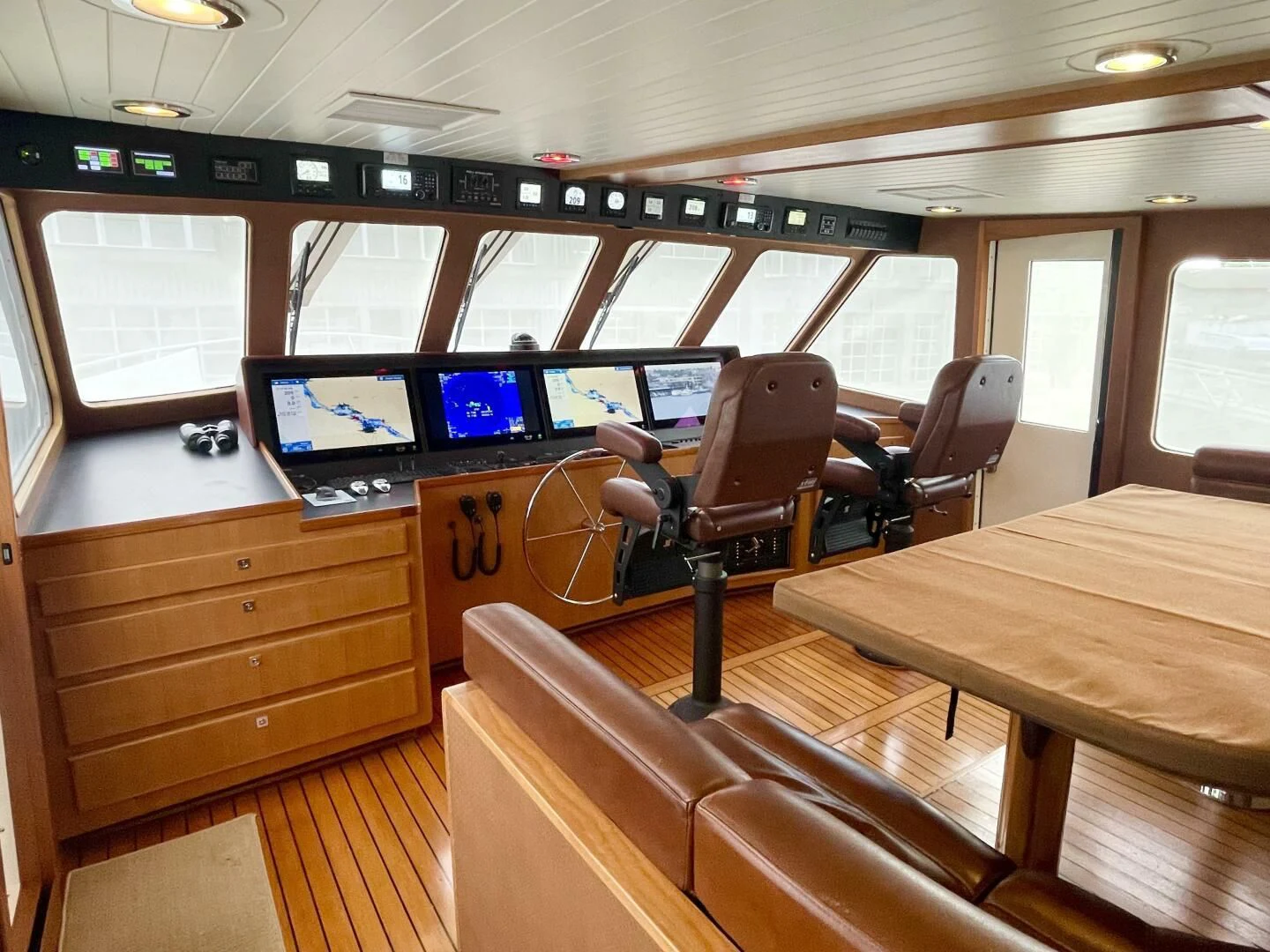 a room with desks and computers aboard SEA LION Yacht for Sale