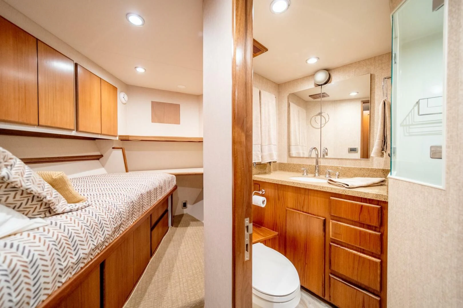 a bedroom with a bed and a sink aboard SEA LION Yacht for Sale