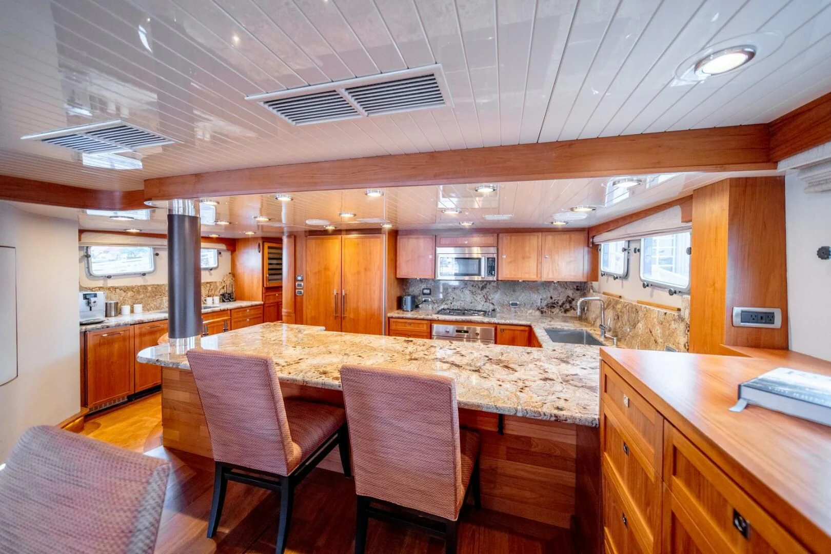 a kitchen with a large island aboard SEA LION Yacht for Sale