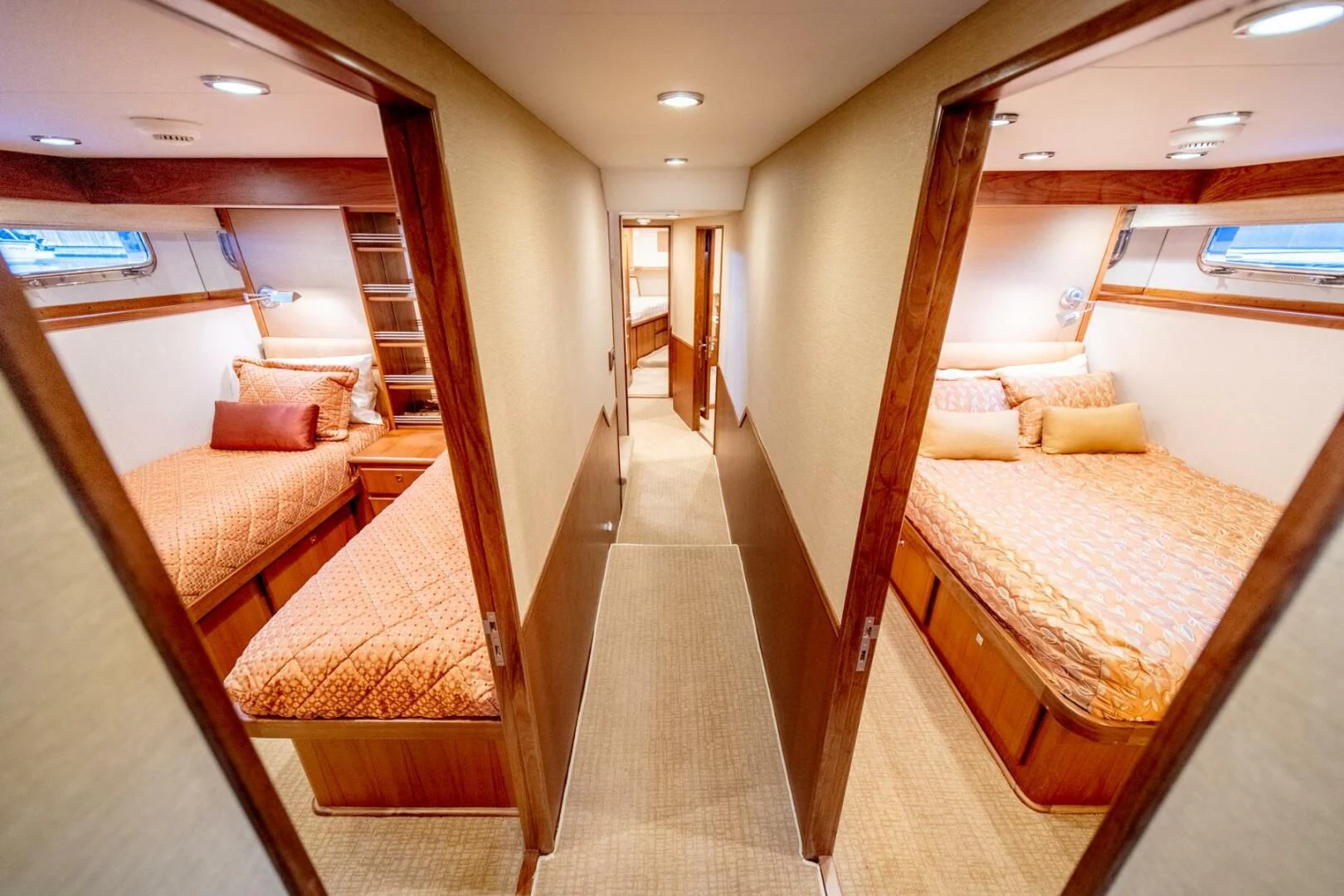 a room with a bed and a mirror aboard SEA LION Yacht for Sale