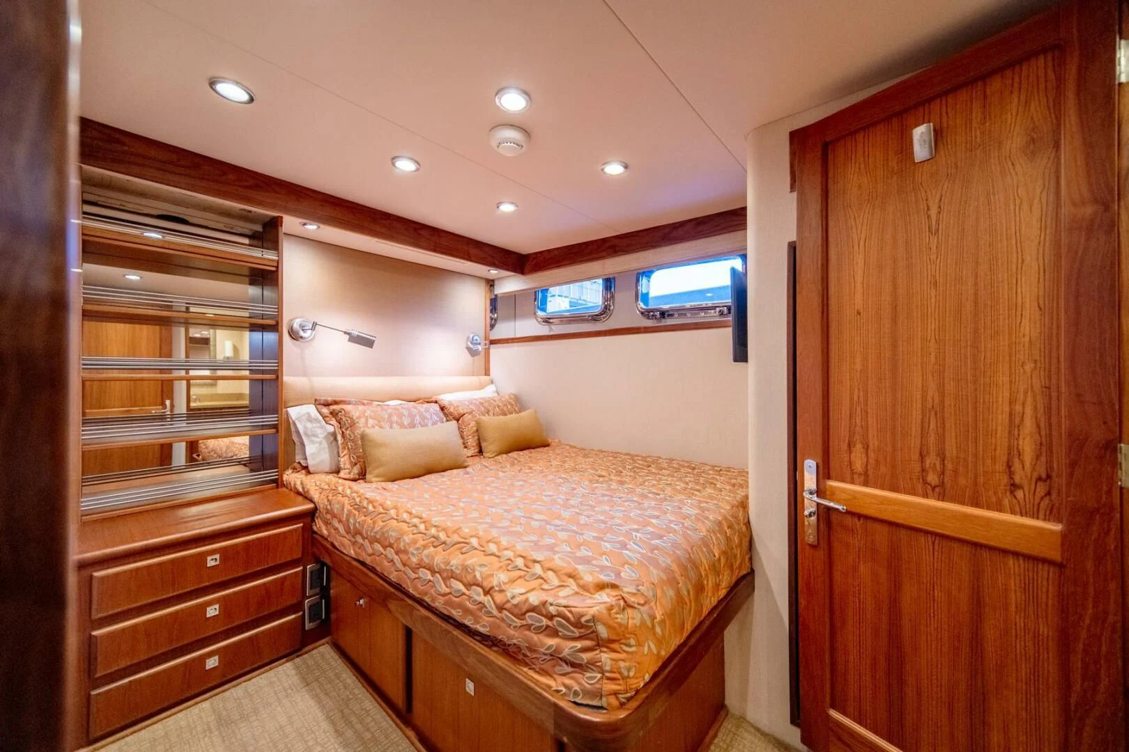 a bedroom with a bed and a closet aboard SEA LION Yacht for Sale