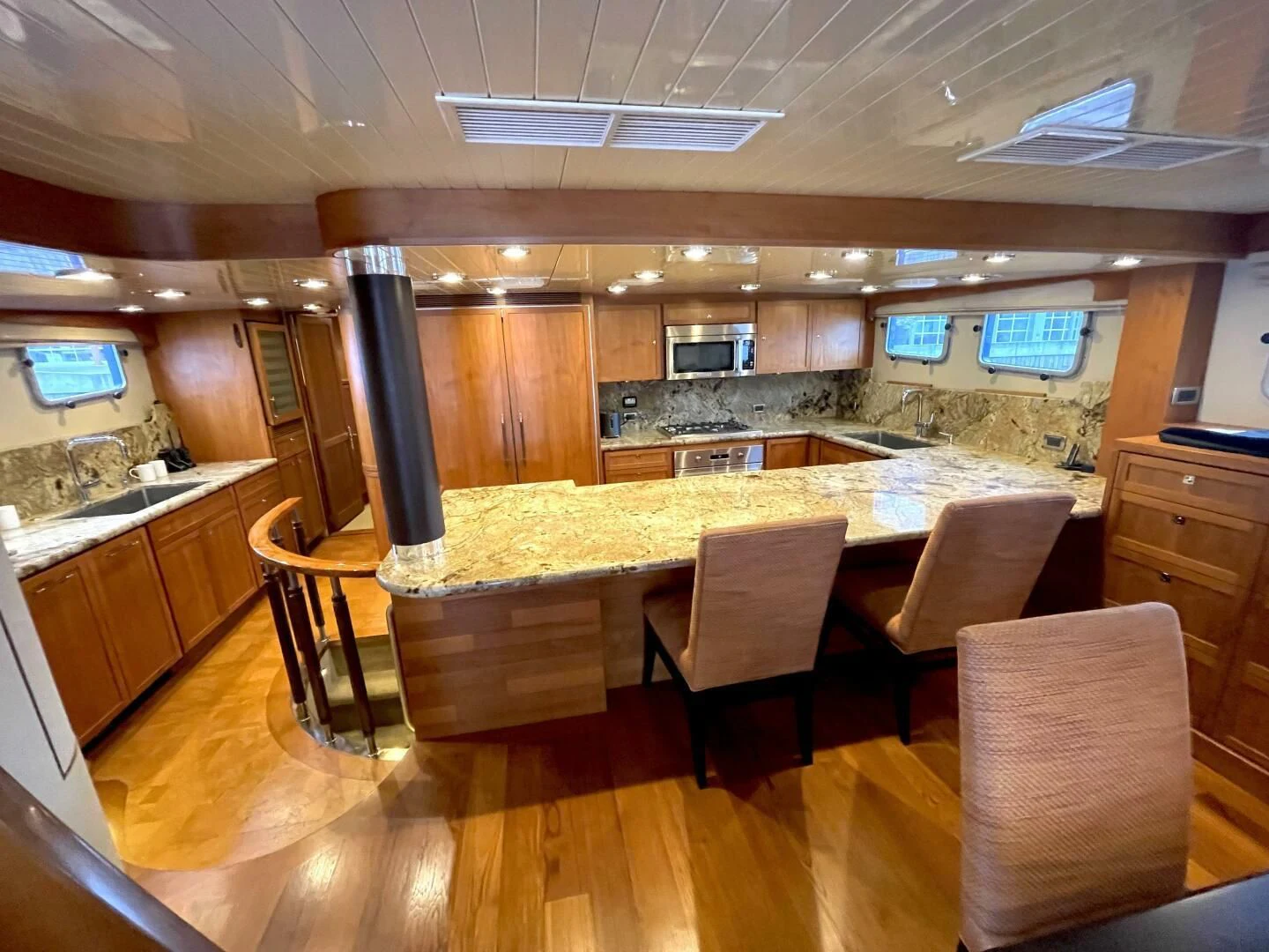 a large kitchen with a bar and bar aboard SEA LION Yacht for Sale