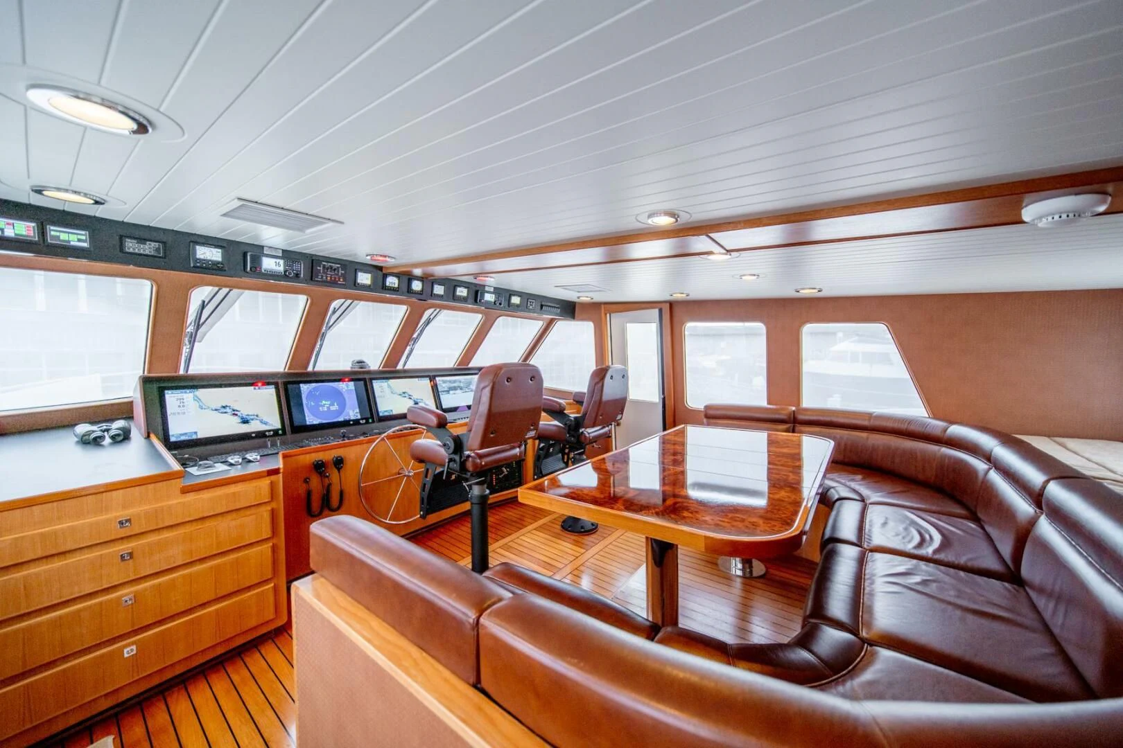 a room with a desk and chairs aboard SEA LION Yacht for Sale