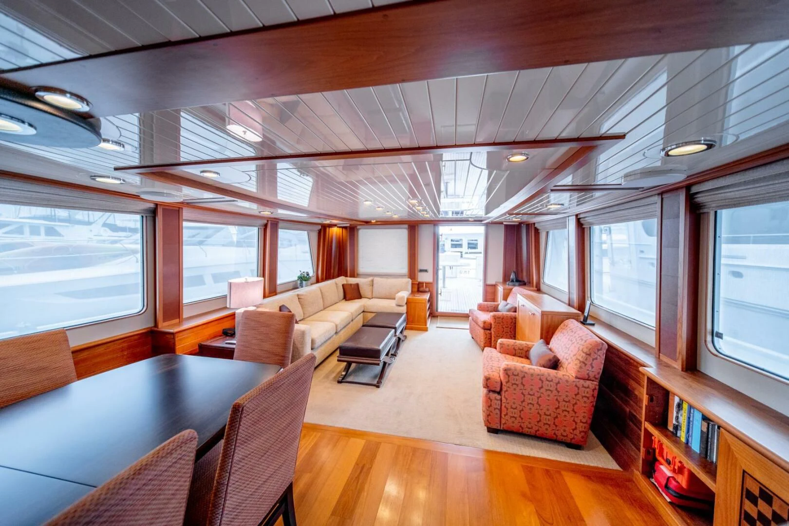 a living room with a wood floor aboard SEA LION Yacht for Sale