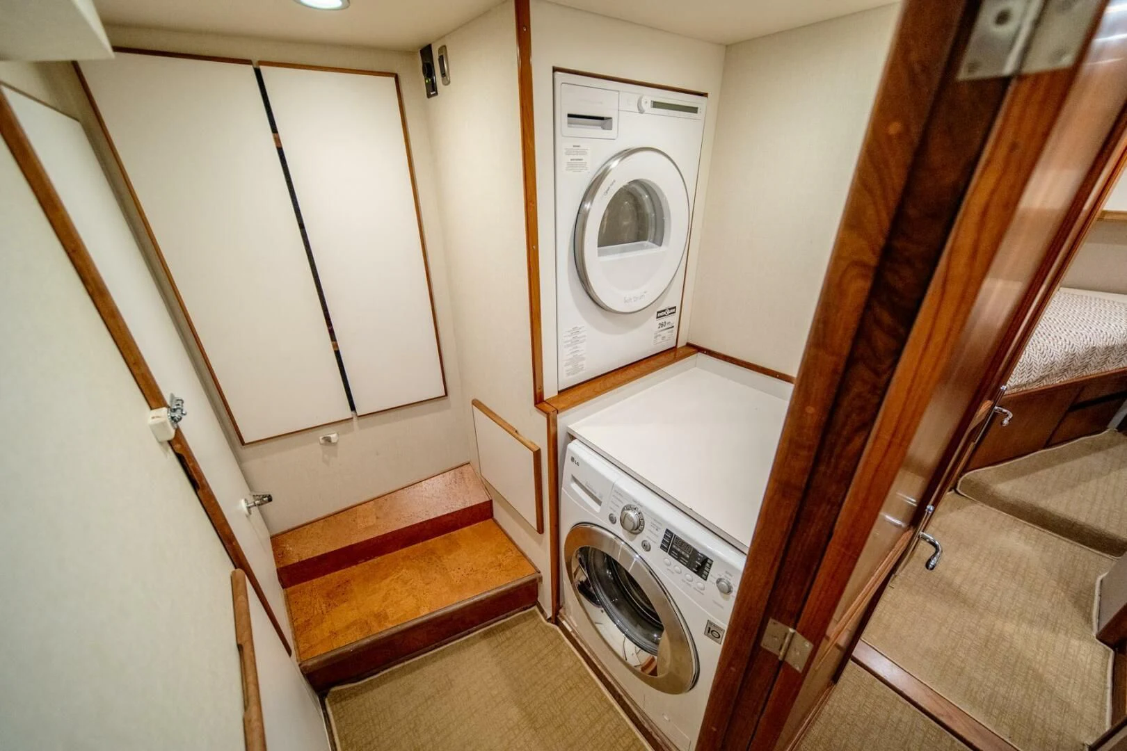 a washer and dryer in a bathroom aboard SEA LION Yacht for Sale
