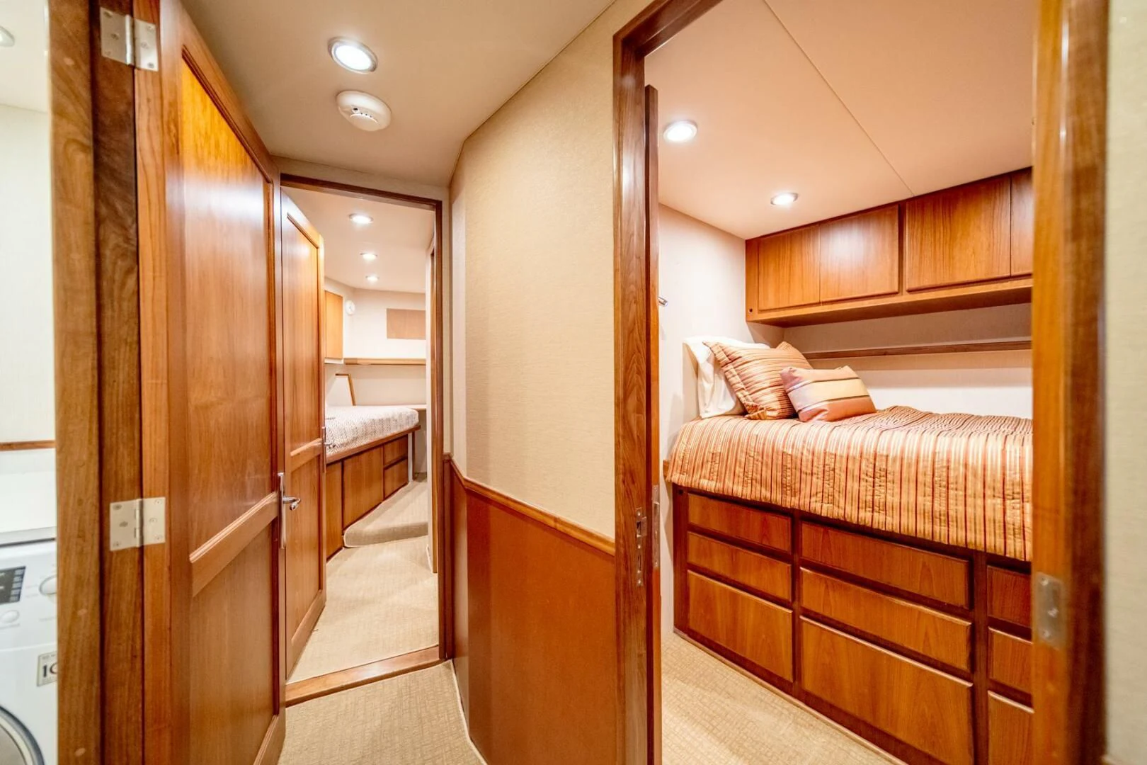 a bedroom with a bed and a closet aboard SEA LION Yacht for Sale