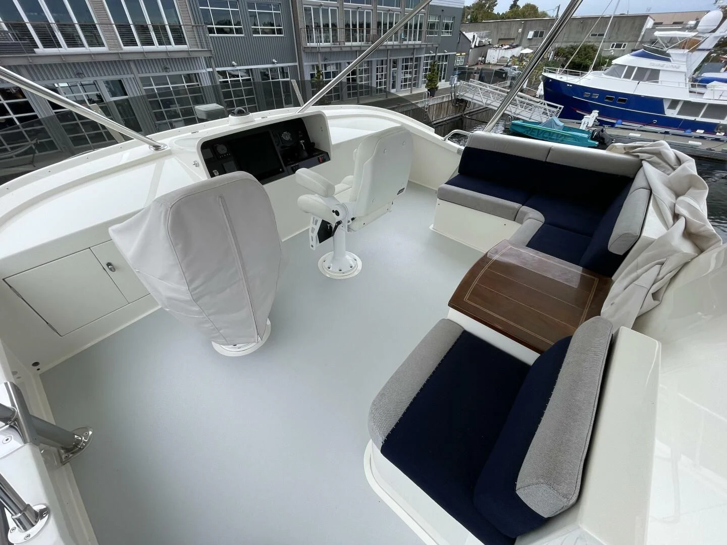 a white chair on a deck aboard SEA LION Yacht for Sale