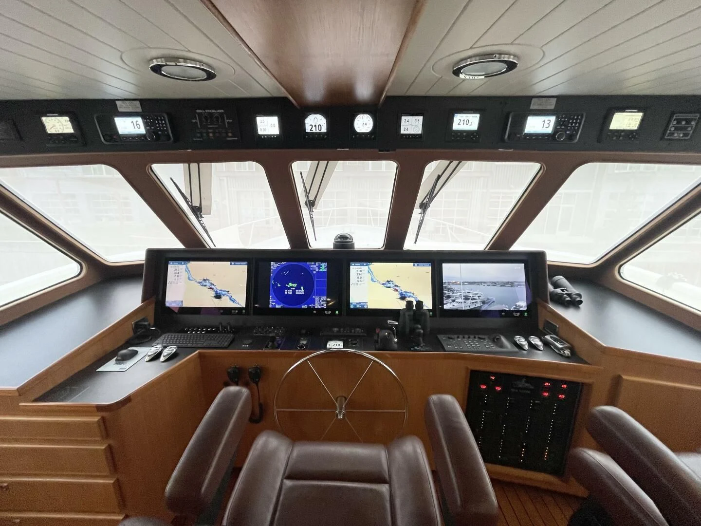 a control room with many monitors aboard SEA LION Yacht for Sale