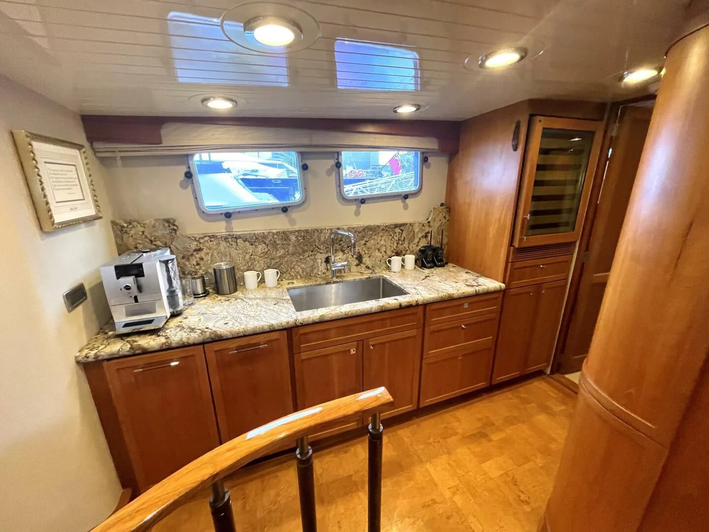 a kitchen with wooden cabinets aboard SEA LION Yacht for Sale