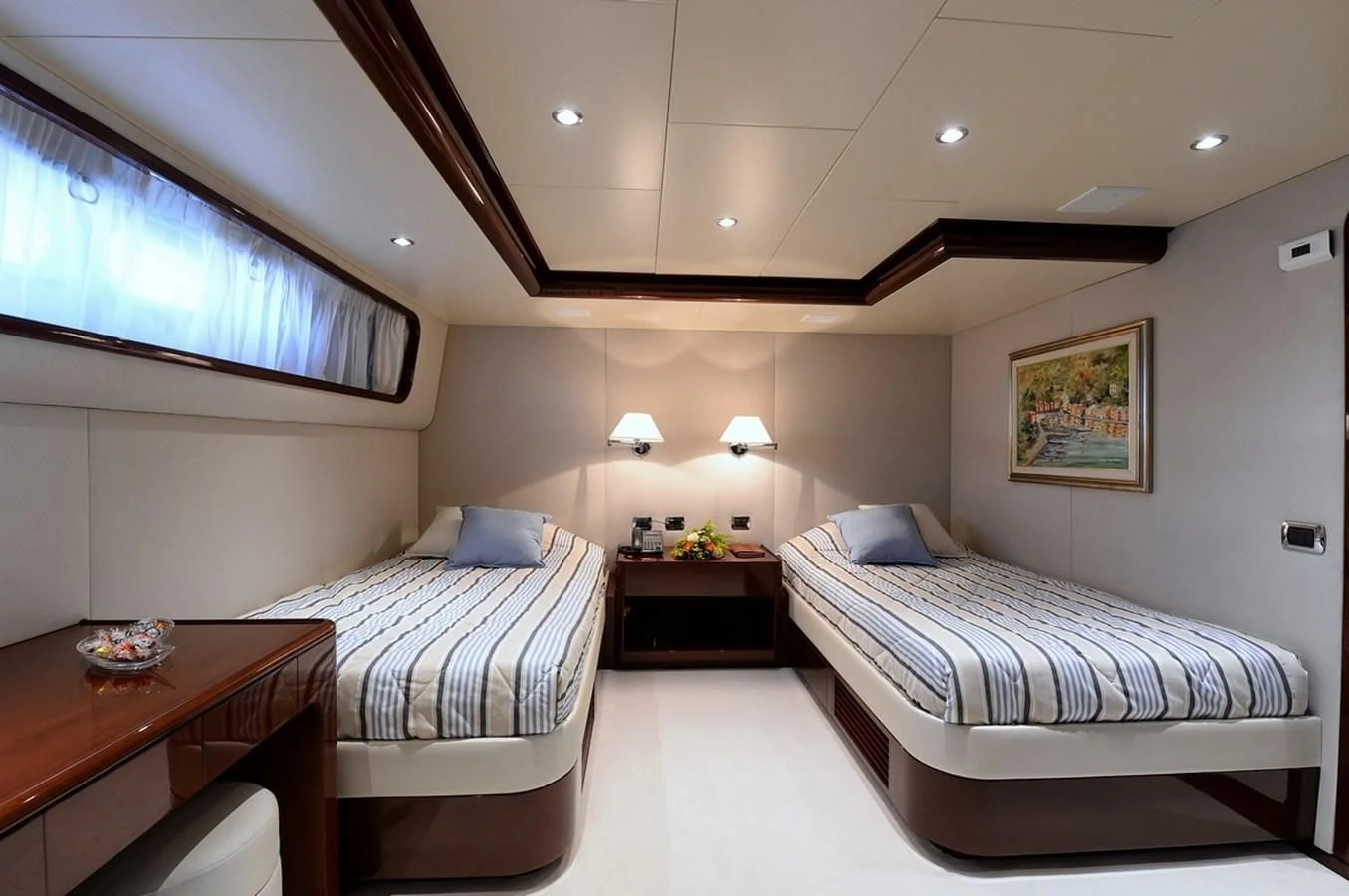 a room with two beds aboard SUITE Yacht for Sale