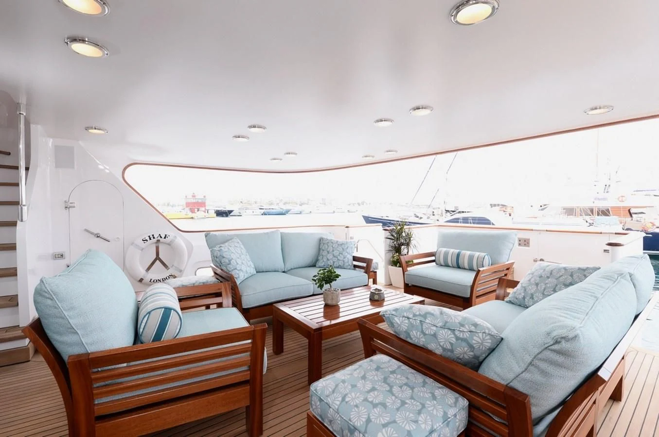 a living room with a couch and a coffee table aboard SUITE Yacht for Sale