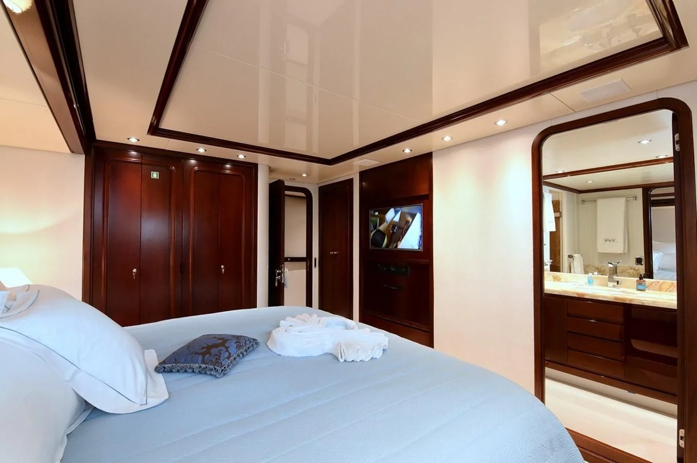 a hotel room with a bed aboard SUITE Yacht for Sale