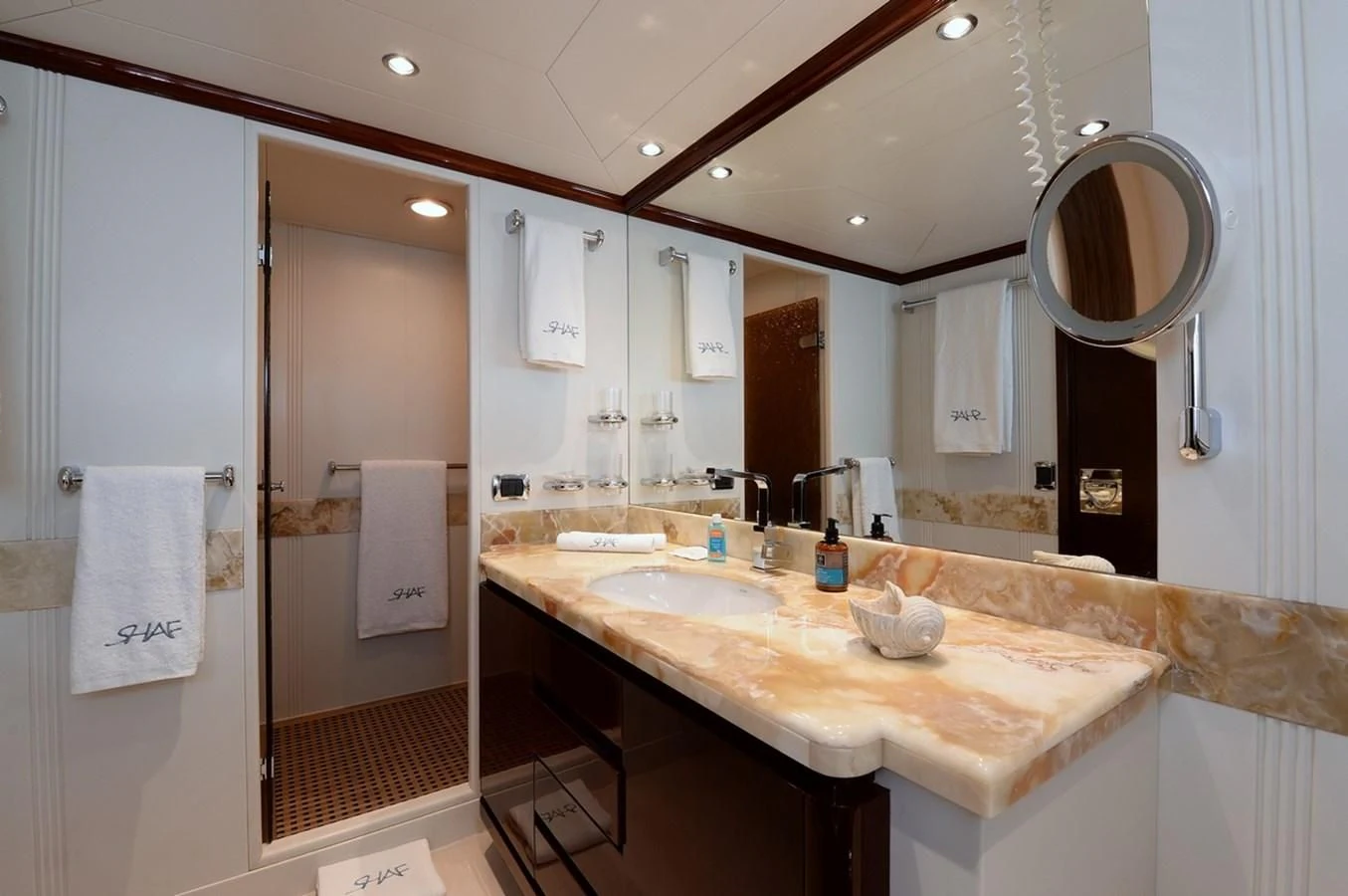 a bathroom with a large mirror aboard SUITE Yacht for Sale