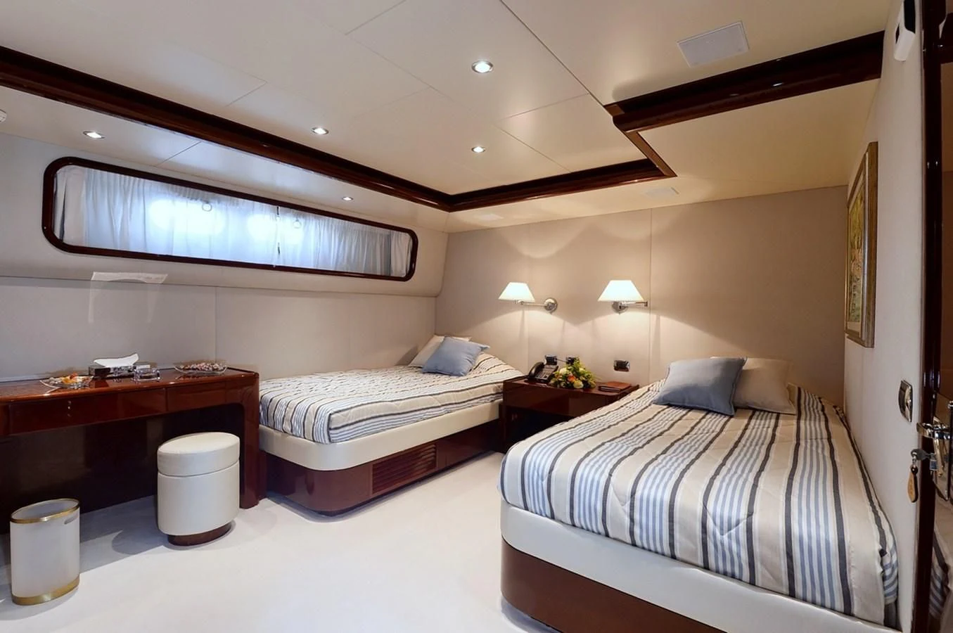 a couple of beds in a hotel room aboard SUITE Yacht for Sale