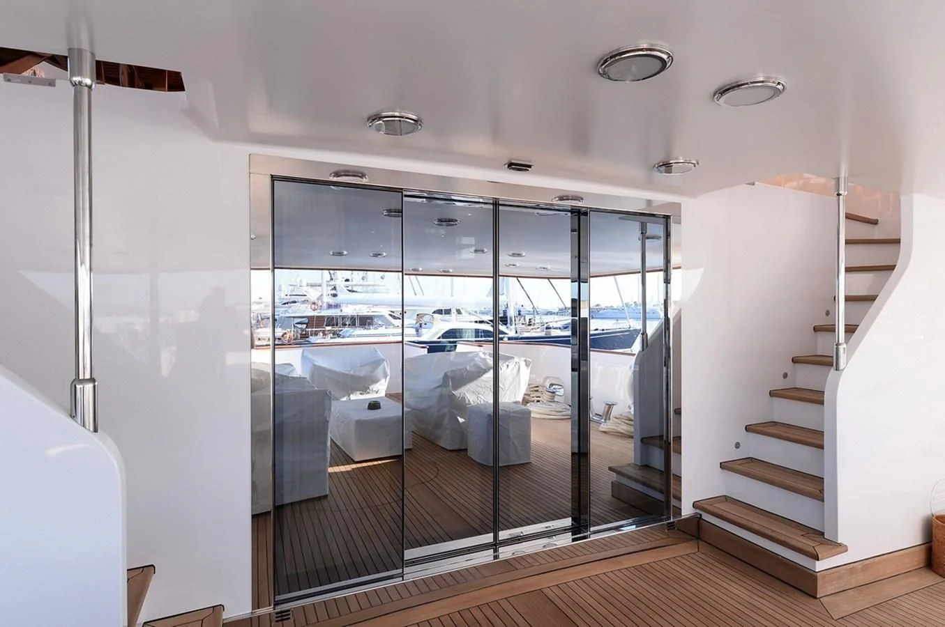 a glass door leading to a room aboard SUITE Yacht for Sale