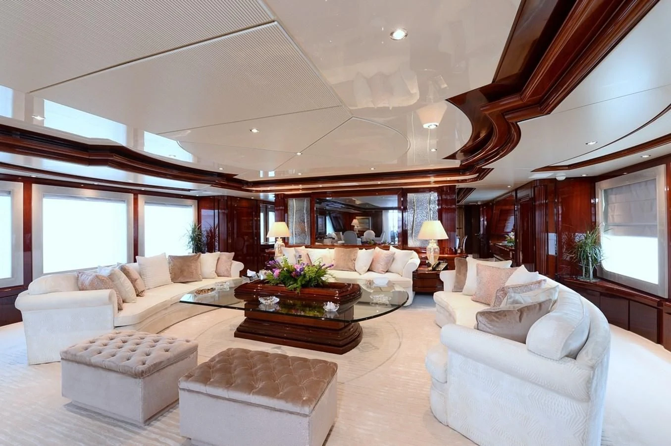a living room with a large ceiling aboard SUITE Yacht for Sale