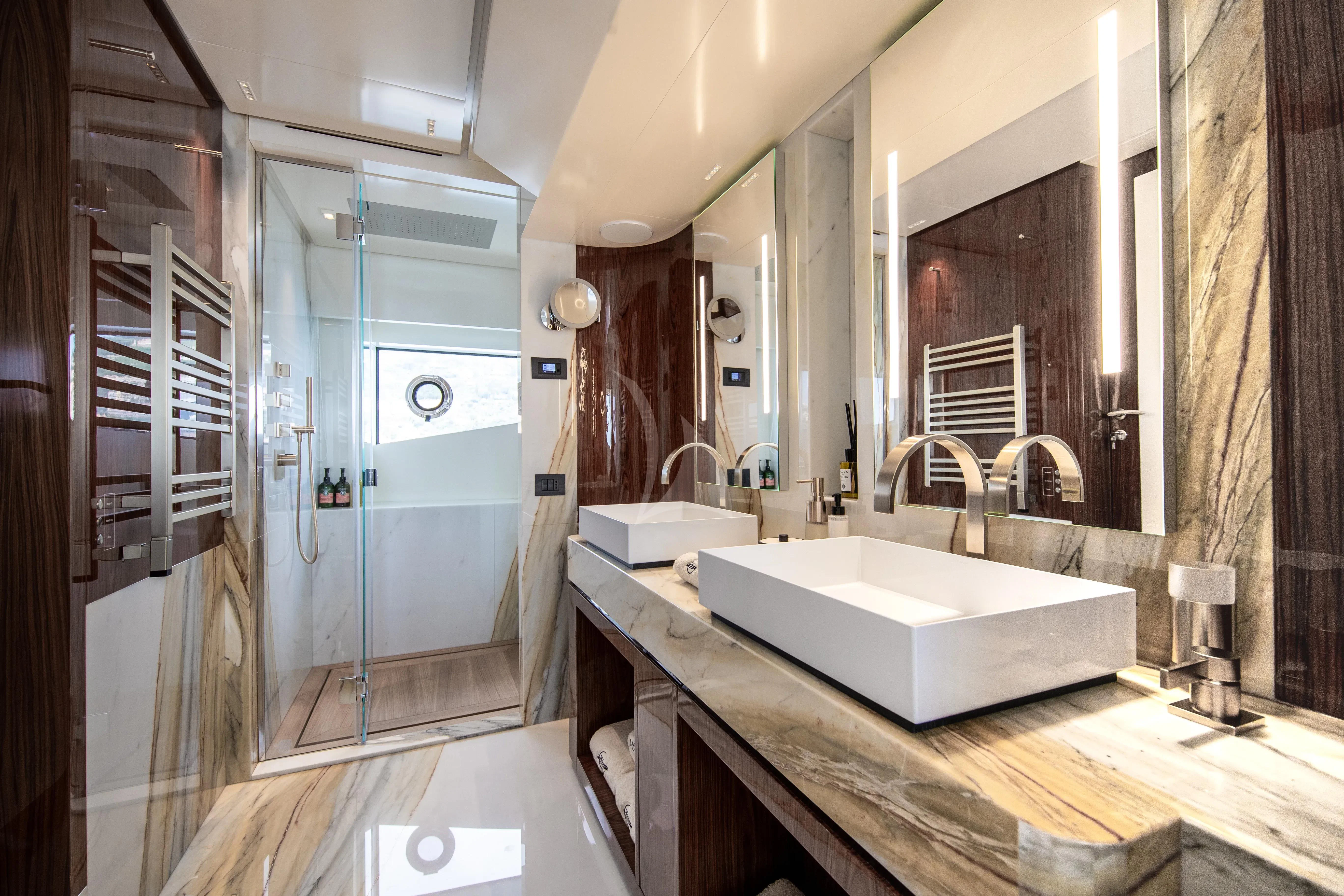 a bathroom with a sink and a mirror aboard LAFAYETTE Yacht for Sale