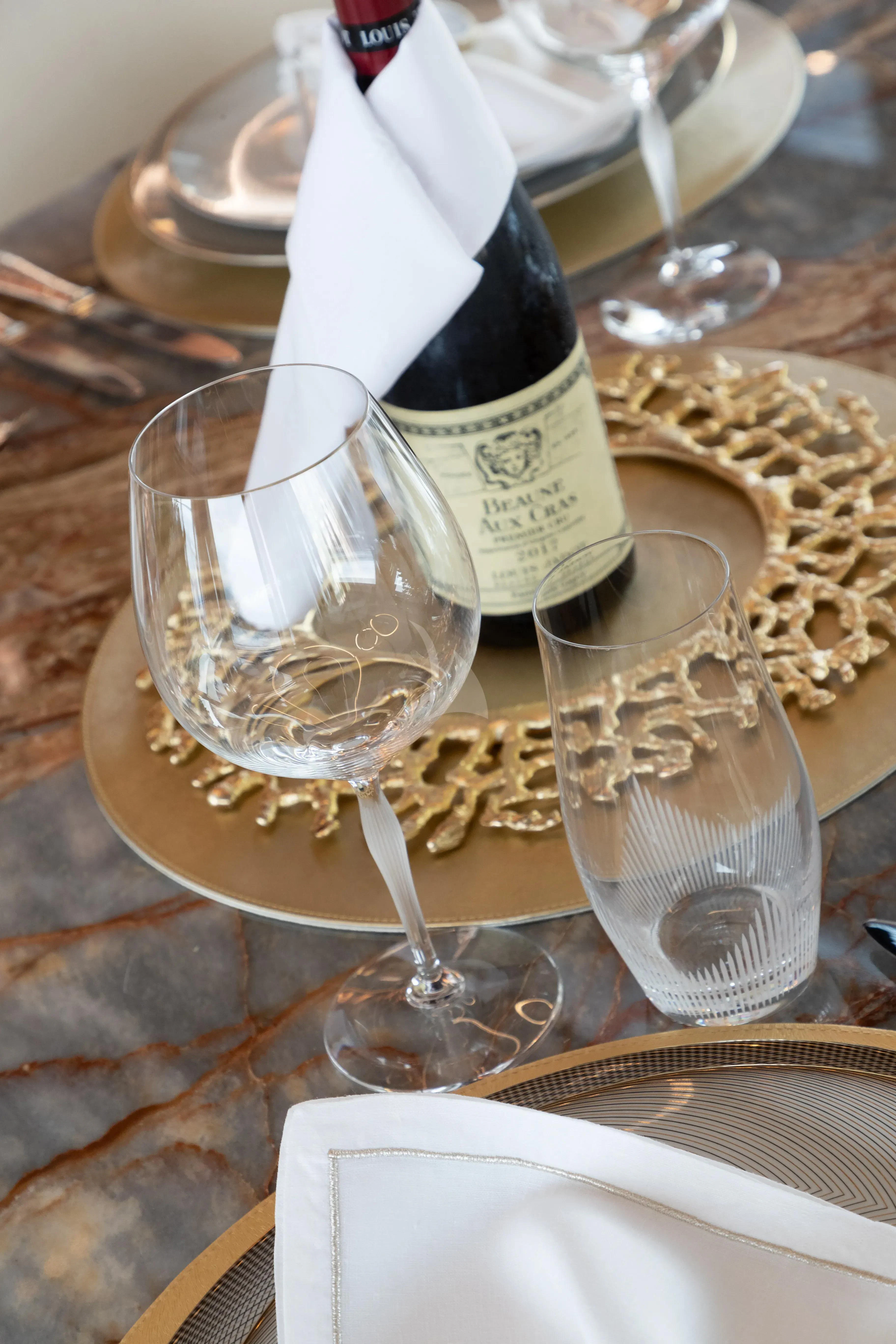a wine glass and bottle on a table aboard LAFAYETTE Yacht for Sale