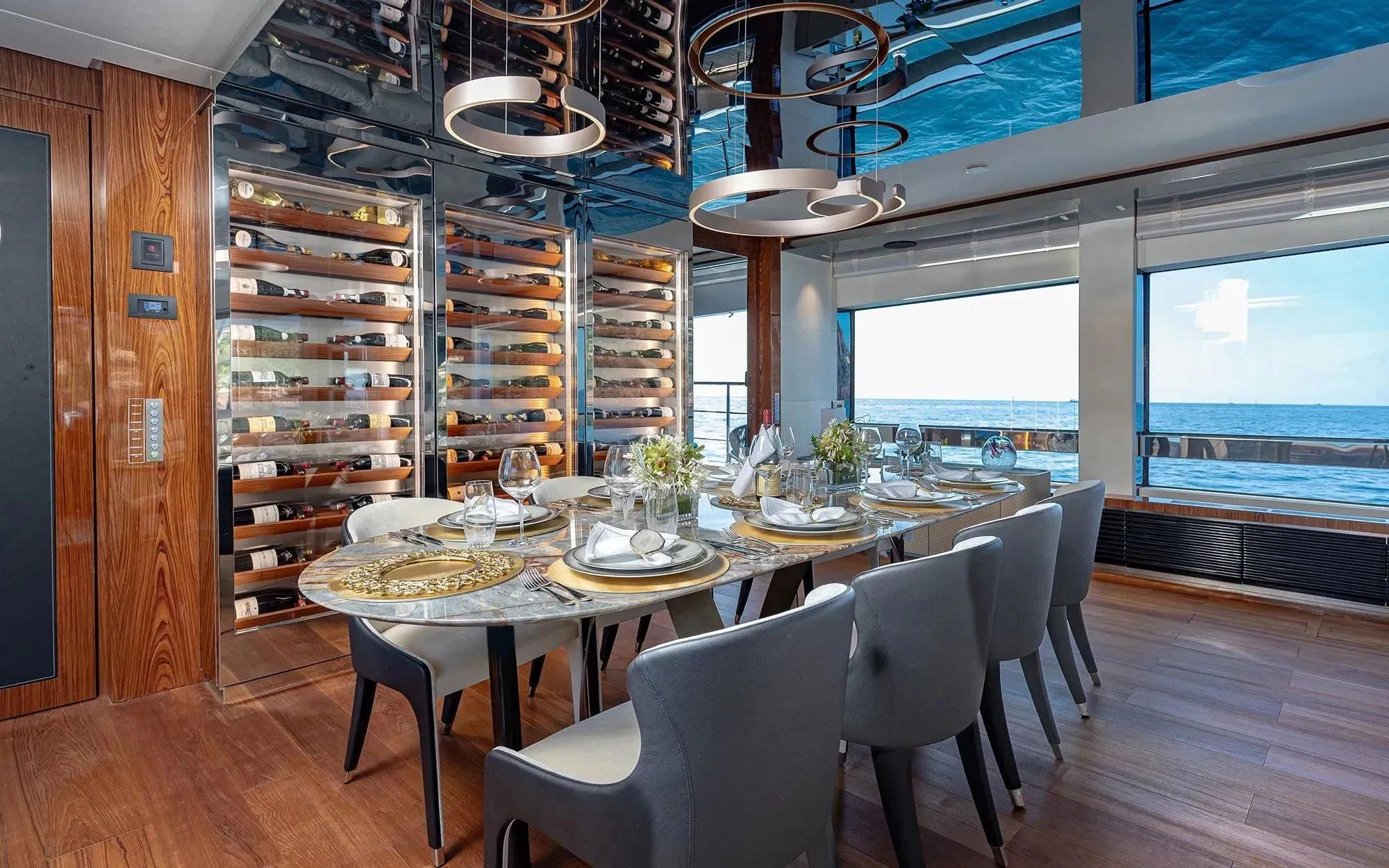 a dining room with a large window aboard LAFAYETTE Yacht for Sale