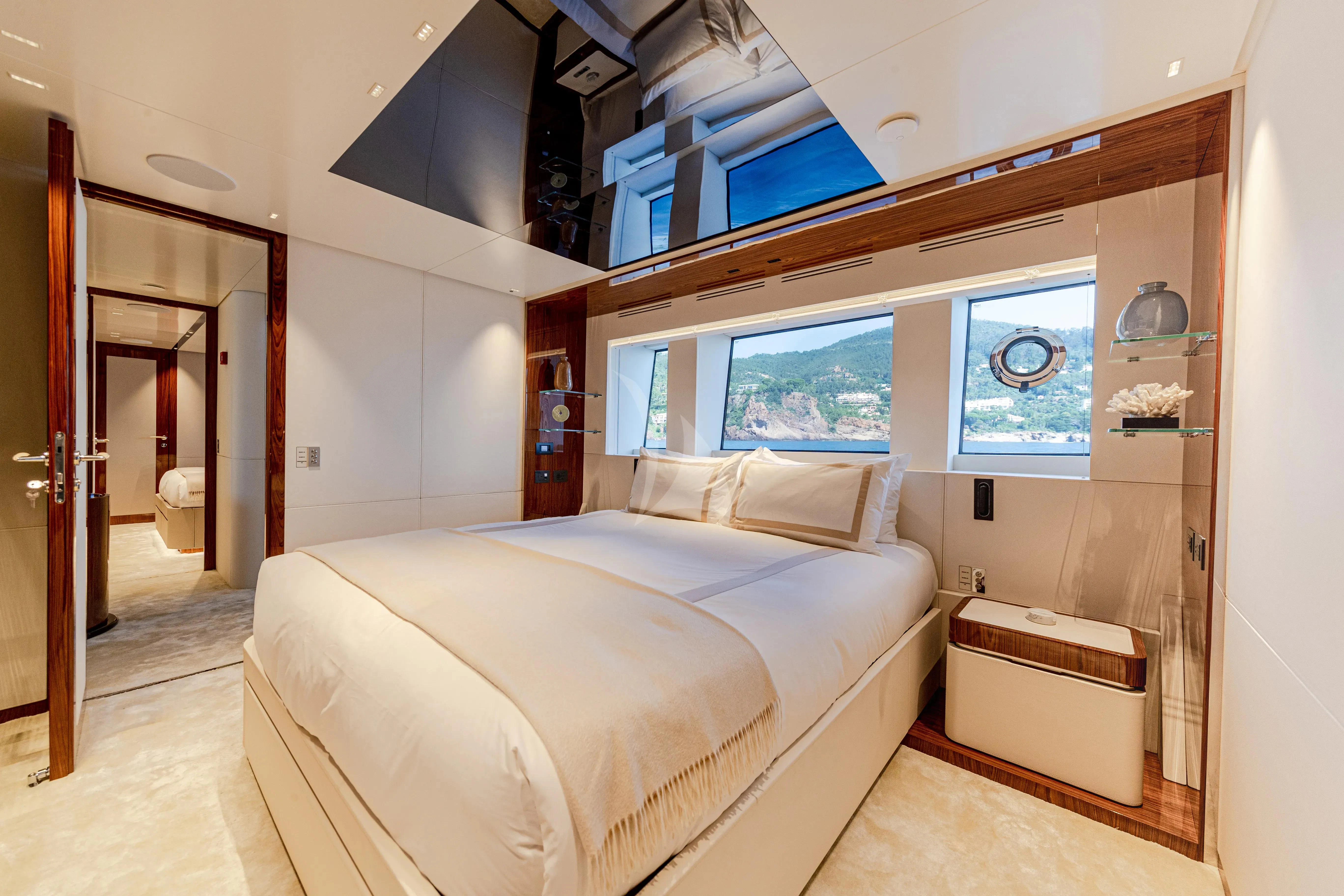 a bedroom with a bed and a window aboard LAFAYETTE Yacht for Sale