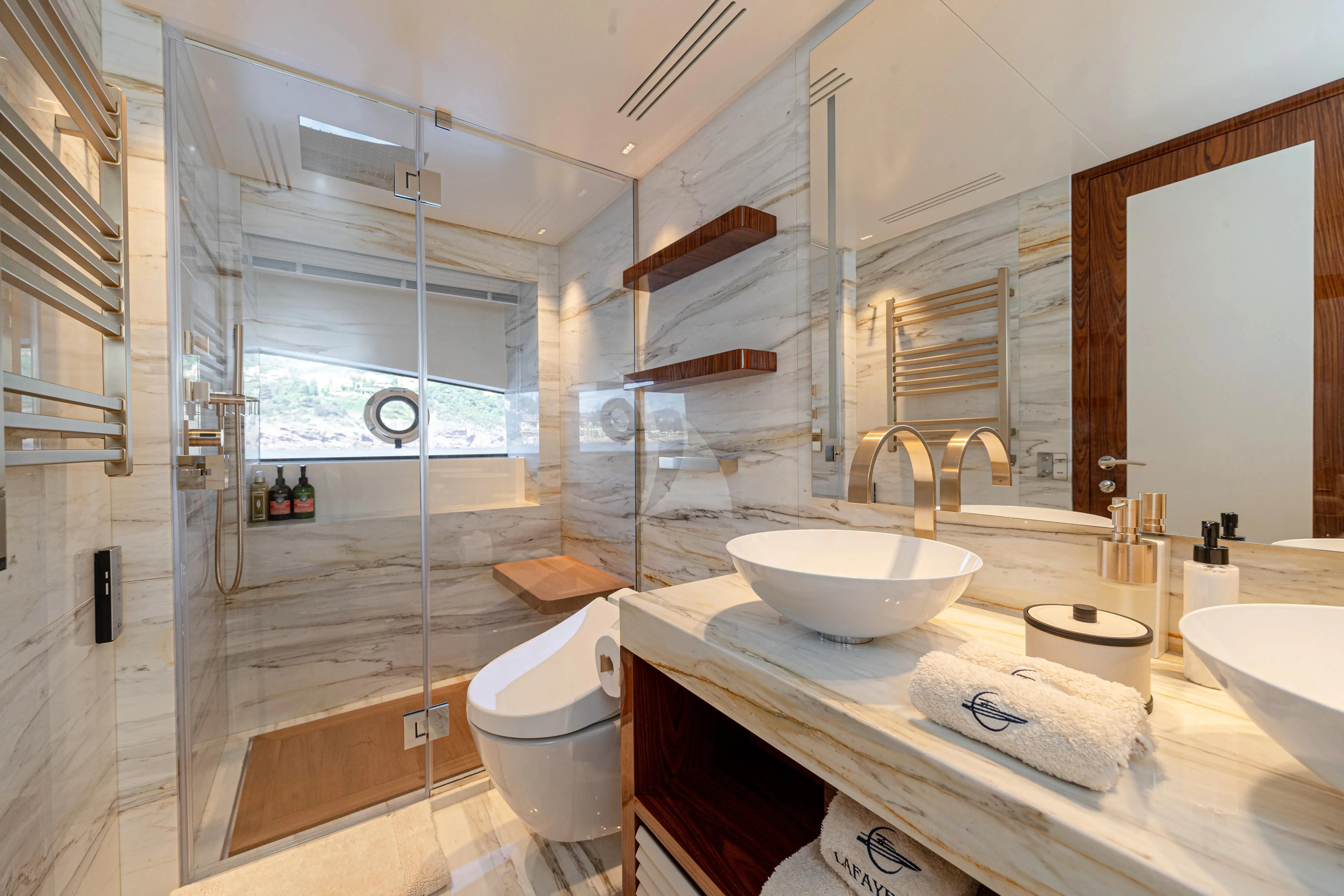 a bathroom with a glass shower aboard LAFAYETTE Yacht for Sale