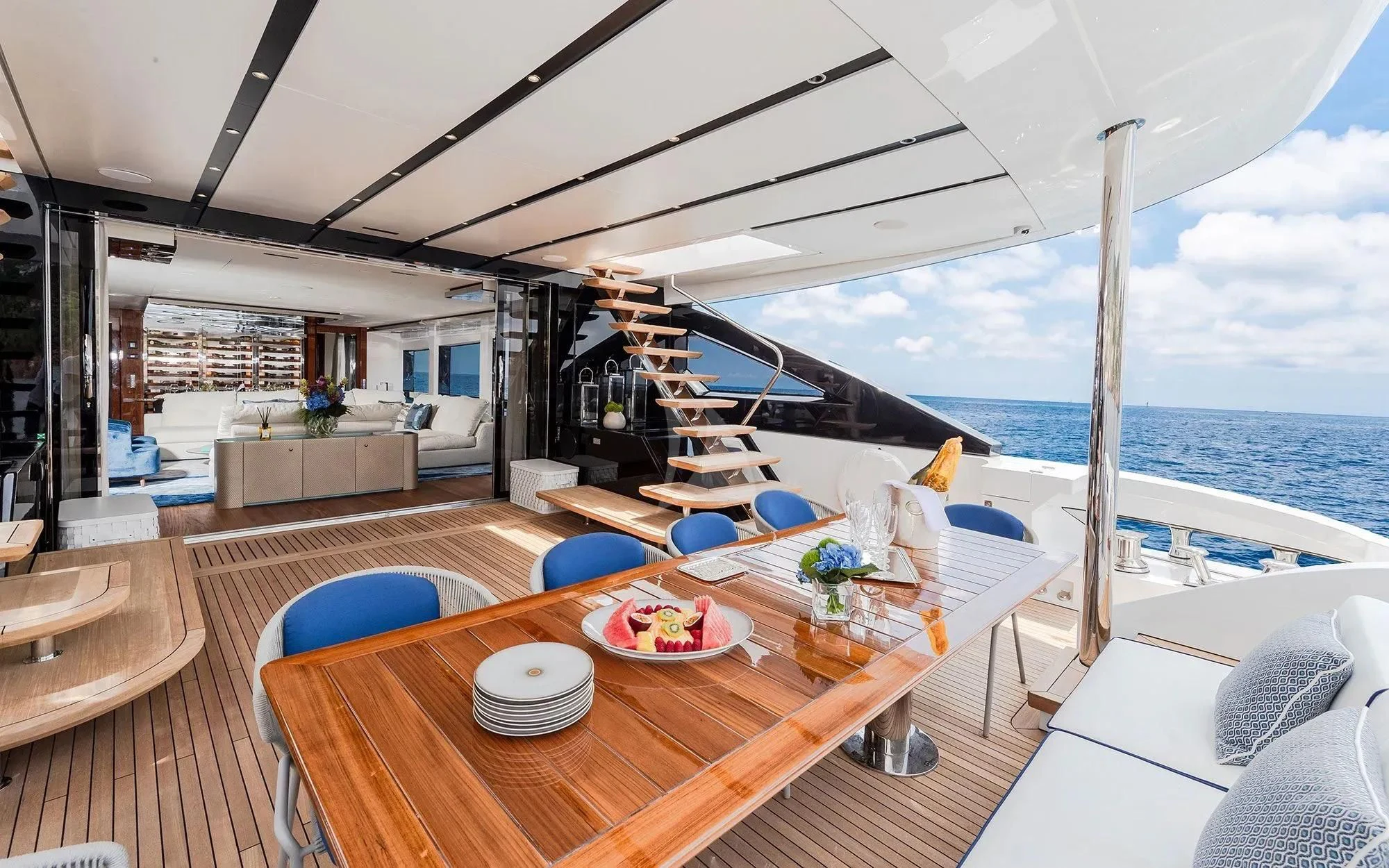a large open space with a table and chairs and a large body of water aboard LAFAYETTE Yacht for Sale