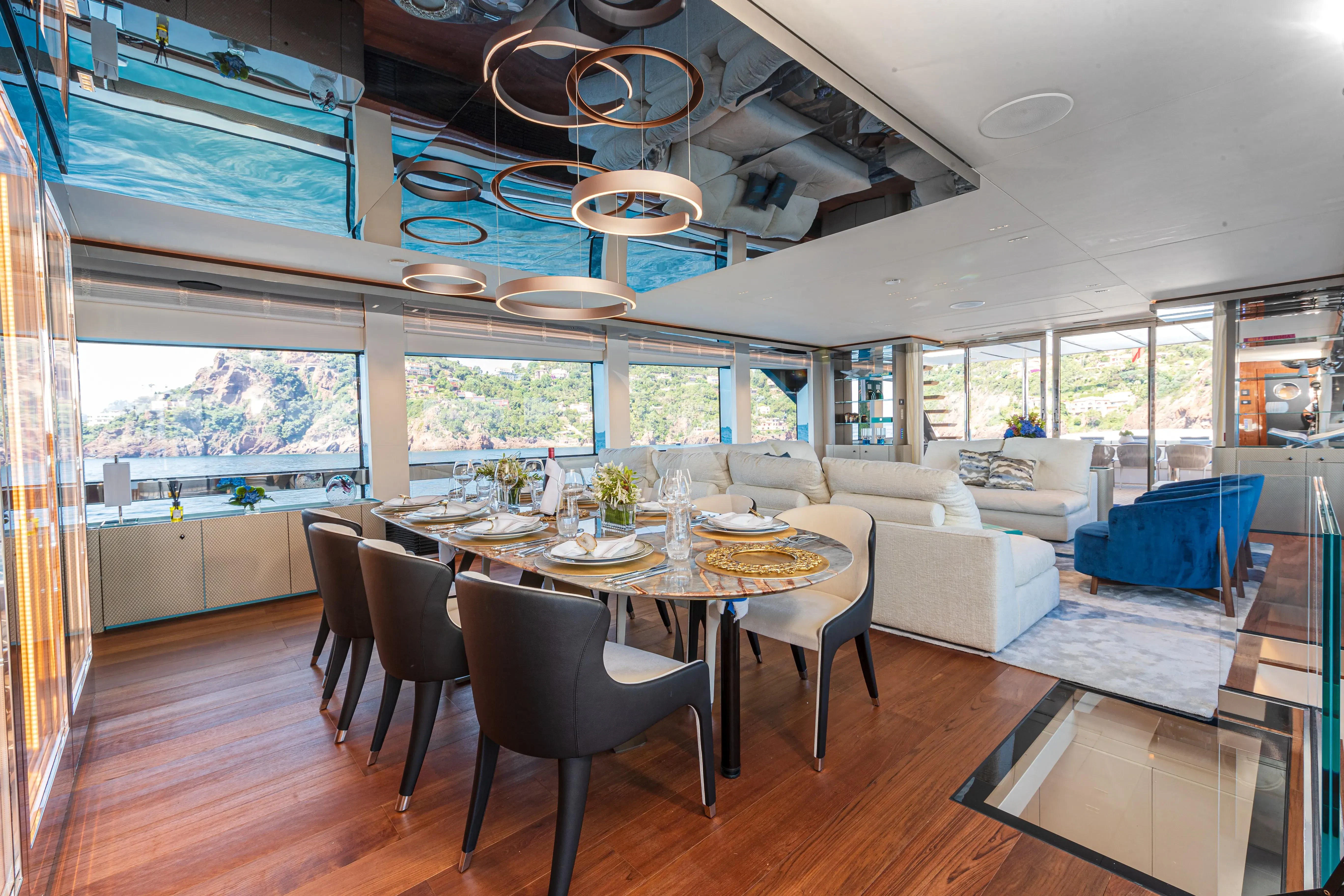 a large dining room with a large table and chairs aboard LAFAYETTE Yacht for Sale