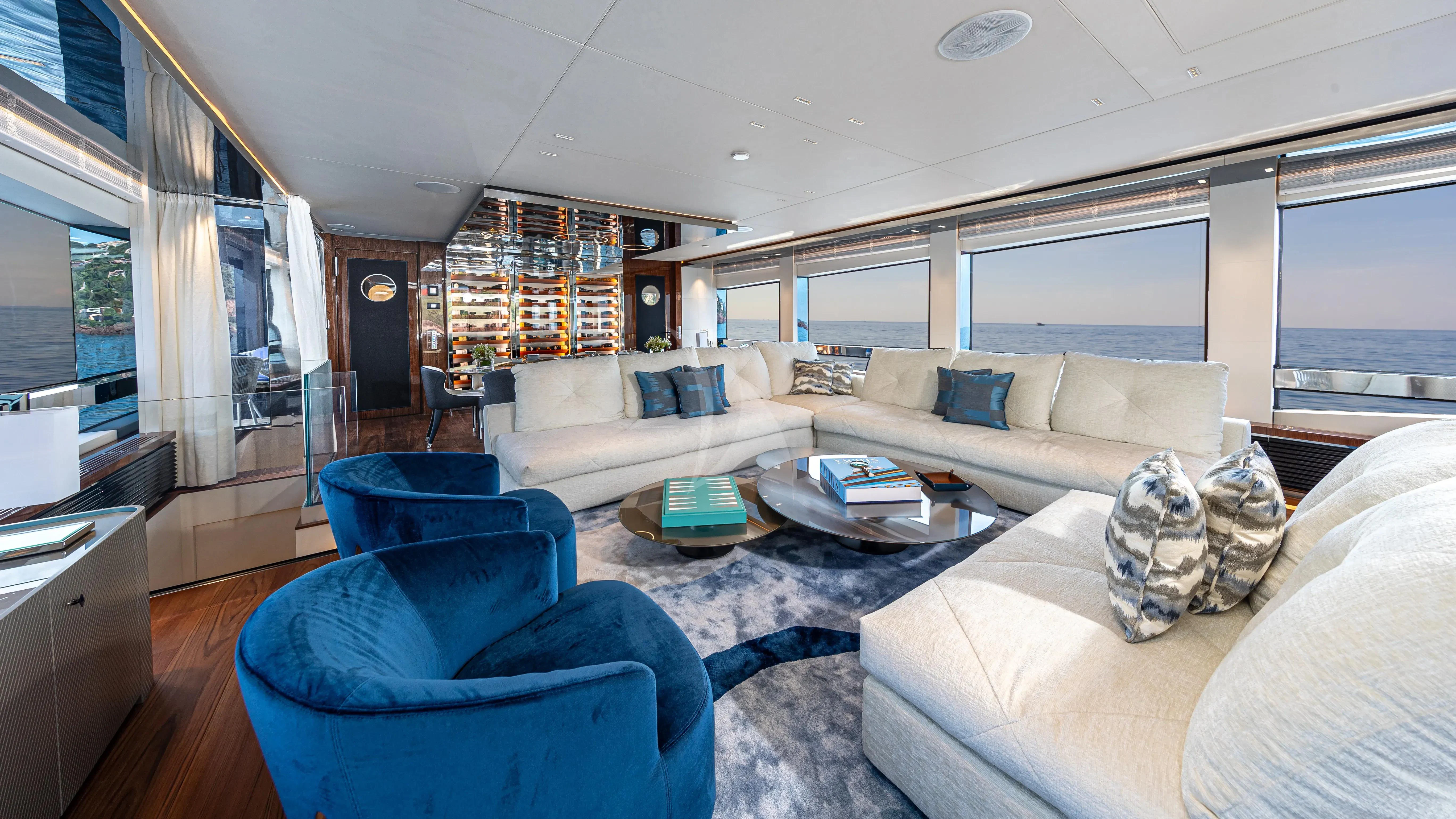 a living room with a couch and a table aboard LAFAYETTE Yacht for Sale