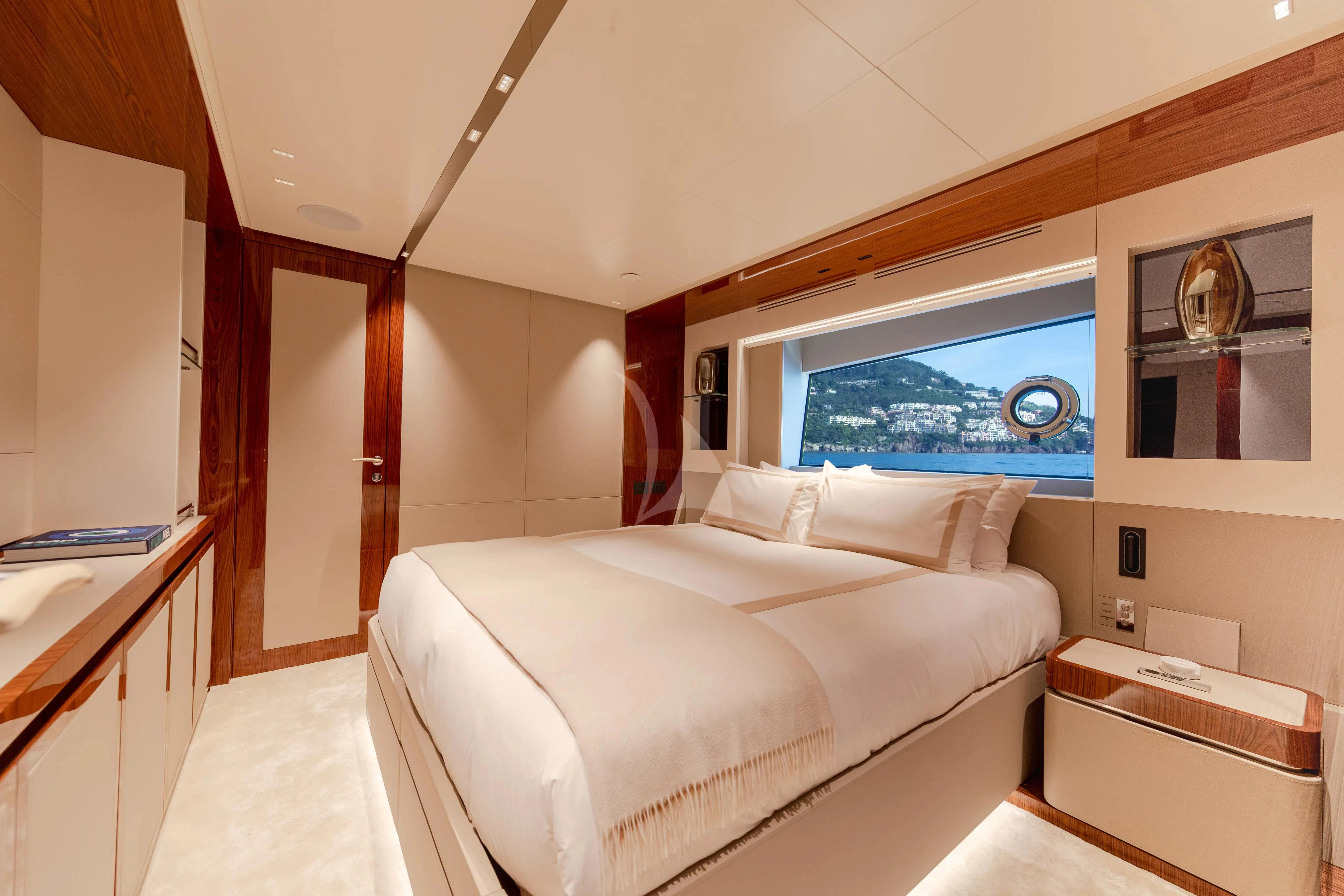 a room with a bed and a window aboard LAFAYETTE Yacht for Sale