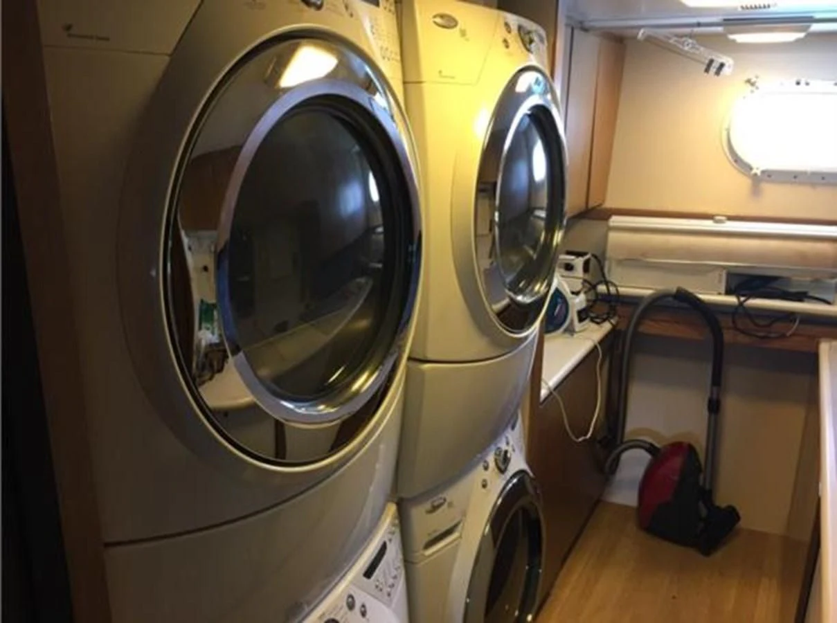 a white machine with a round black object on the side aboard MYC Yacht for Sale