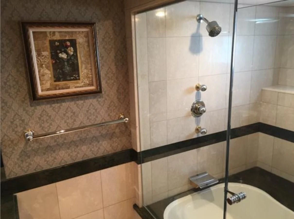 a bathroom with a picture on the wall aboard MYC Yacht for Sale
