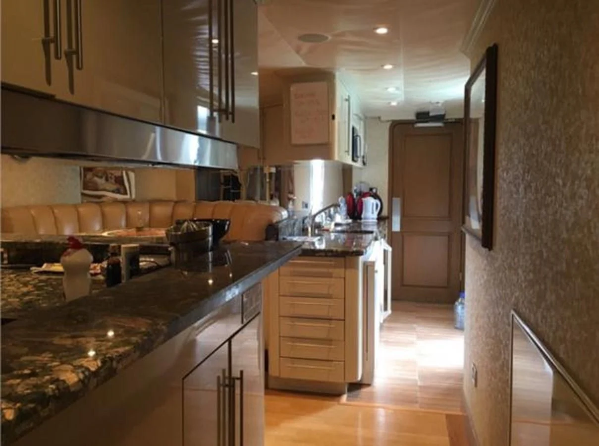 a kitchen with a large island aboard MYC Yacht for Sale