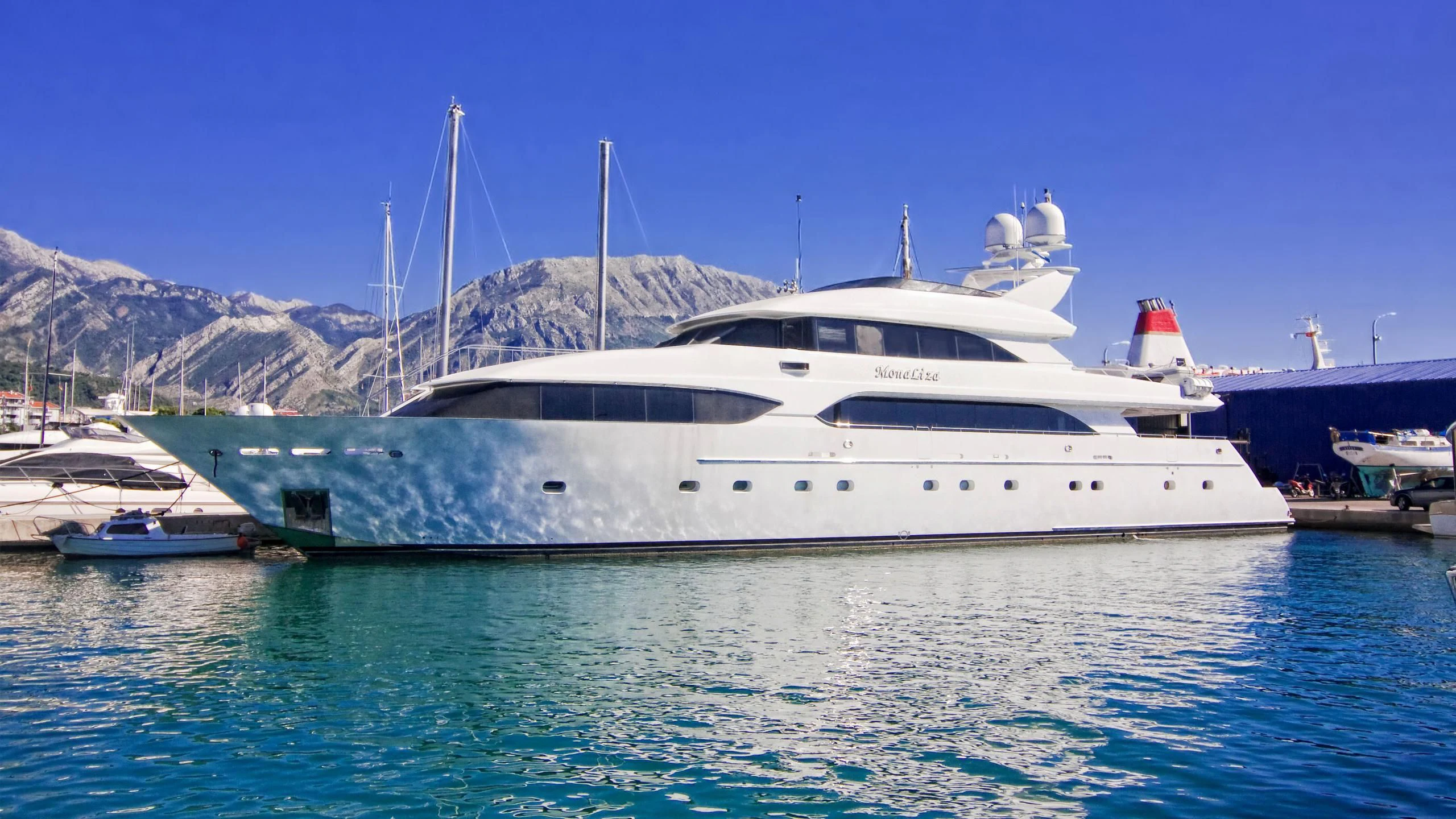 a white yacht in the water aboard MYC Yacht for Sale