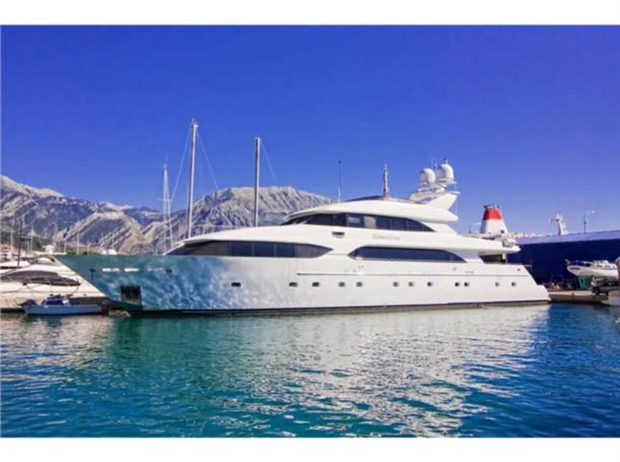 a white yacht in the water aboard MYC Yacht for Sale