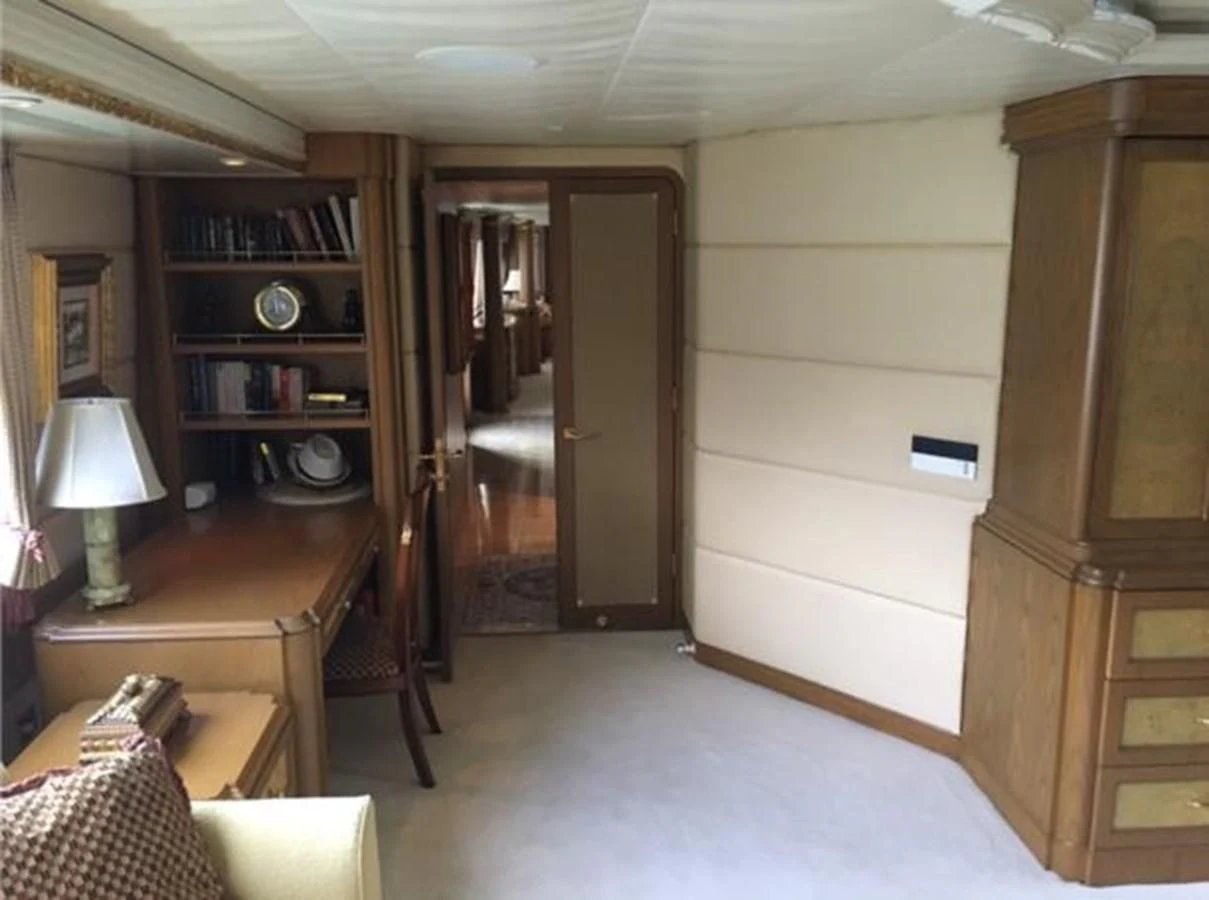 a room with a bed and a desk aboard MYC Yacht for Sale
