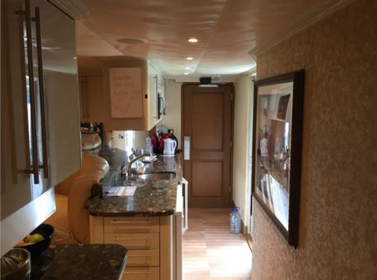 a kitchen with a large window aboard MYC Yacht for Sale