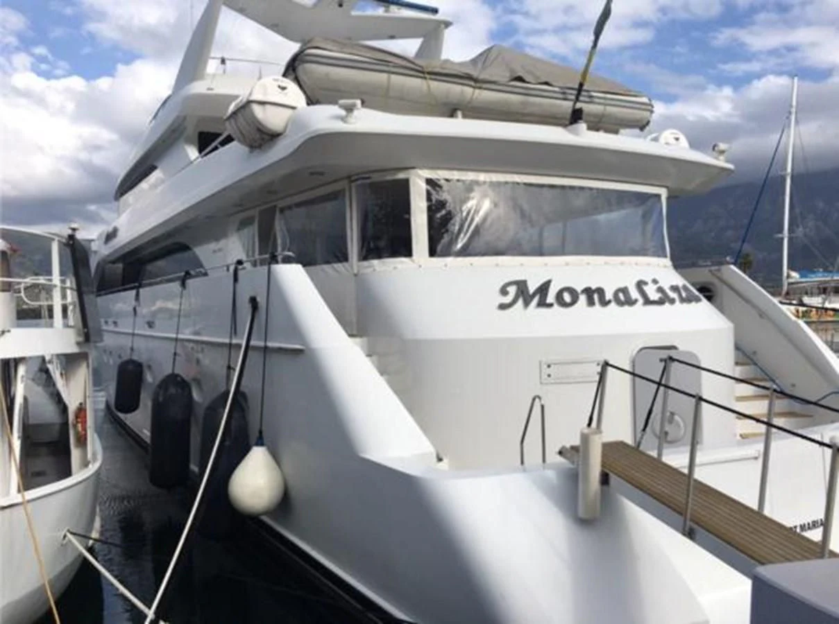 a white yacht on the water aboard MYC Yacht for Sale