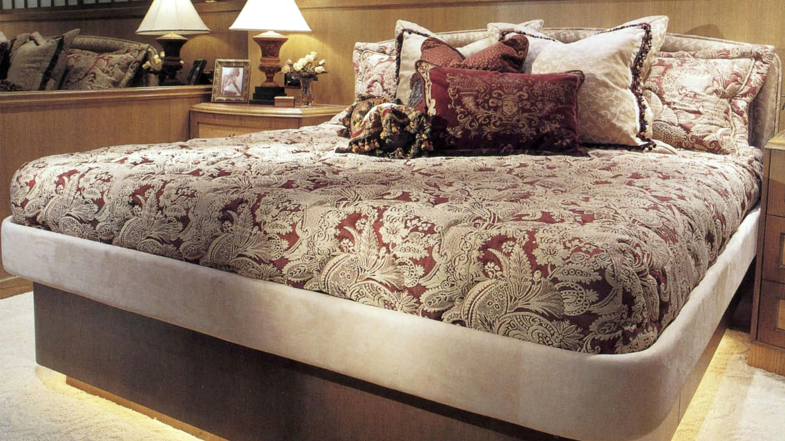 a bed with a pillow and pillows aboard MYC Yacht for Sale