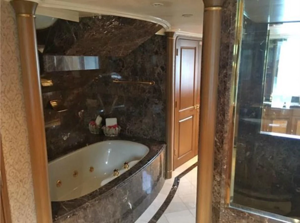 a bathroom with a large bathtub aboard MYC Yacht for Sale