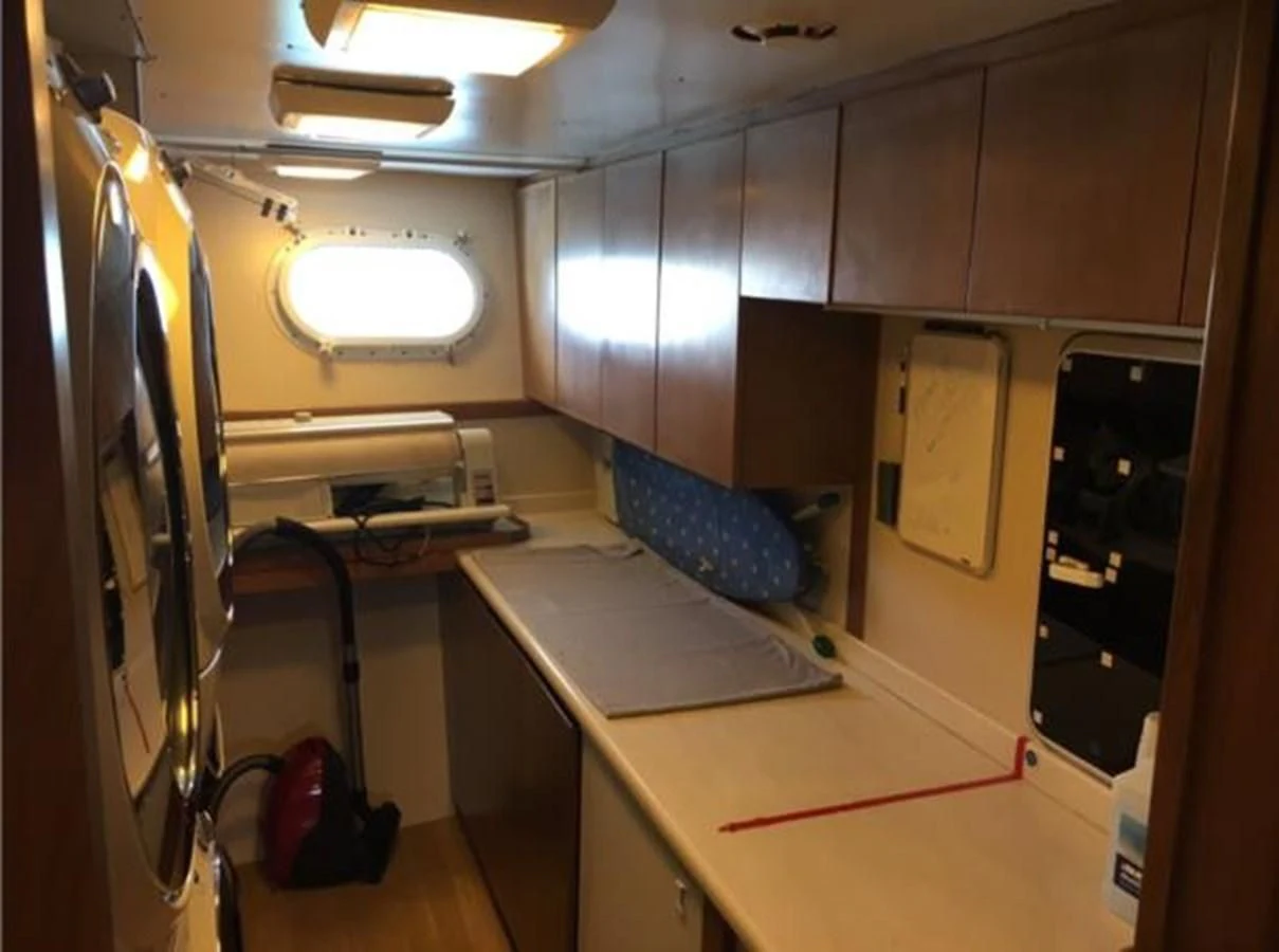 a room with a desk and a computer aboard MYC Yacht for Sale