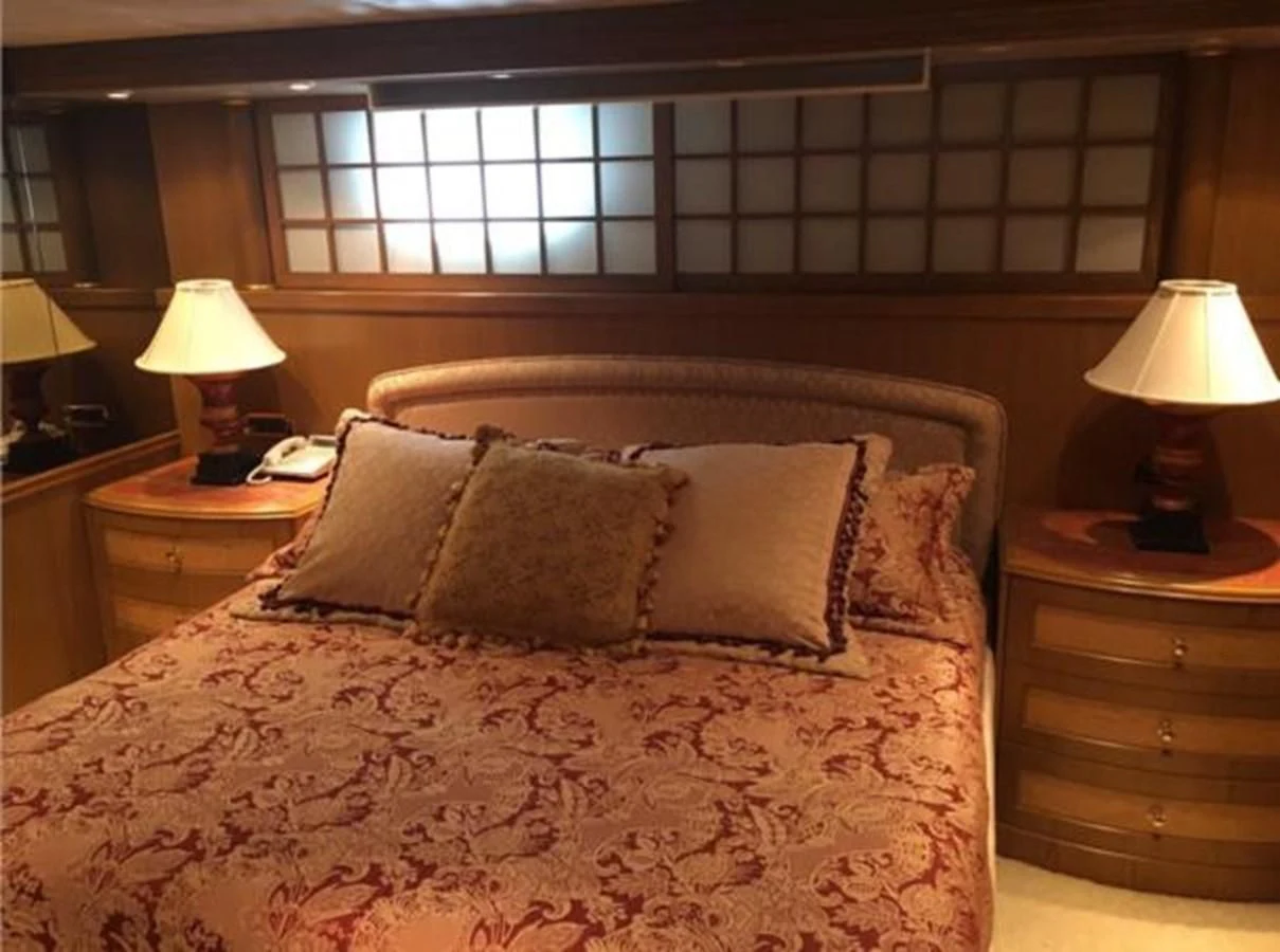 a bed with a large bed spread aboard MYC Yacht for Sale