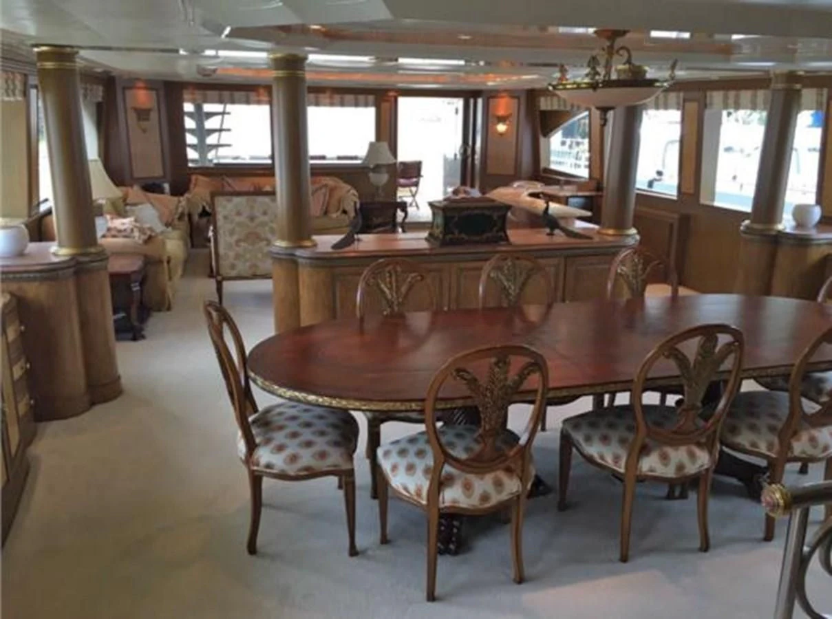 a dining room with chairs aboard MYC Yacht for Sale