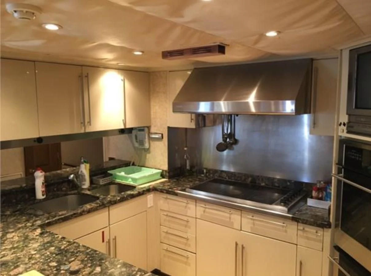 a kitchen with a large island aboard MYC Yacht for Sale