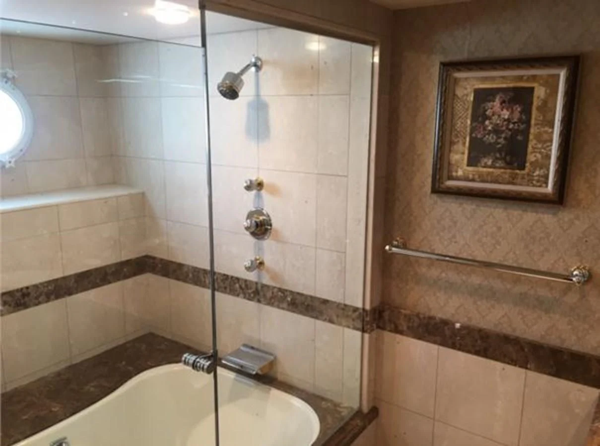 a bathroom with a picture on the wall aboard MYC Yacht for Sale