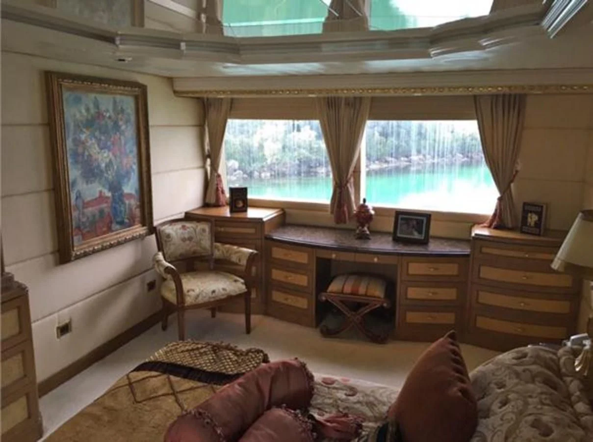 a living room with a piano aboard MYC Yacht for Sale