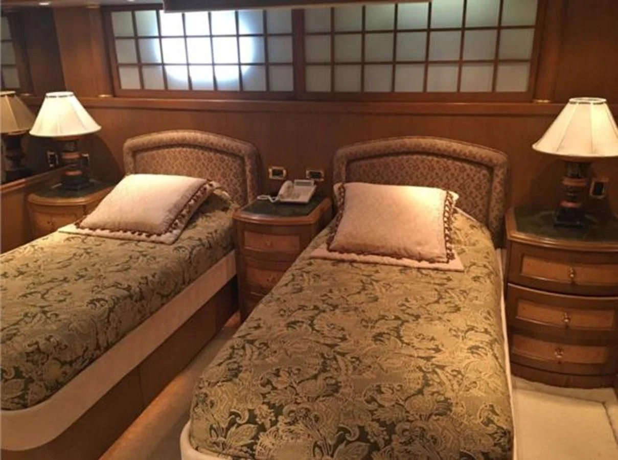 a couple of beds in a hotel room aboard MYC Yacht for Sale
